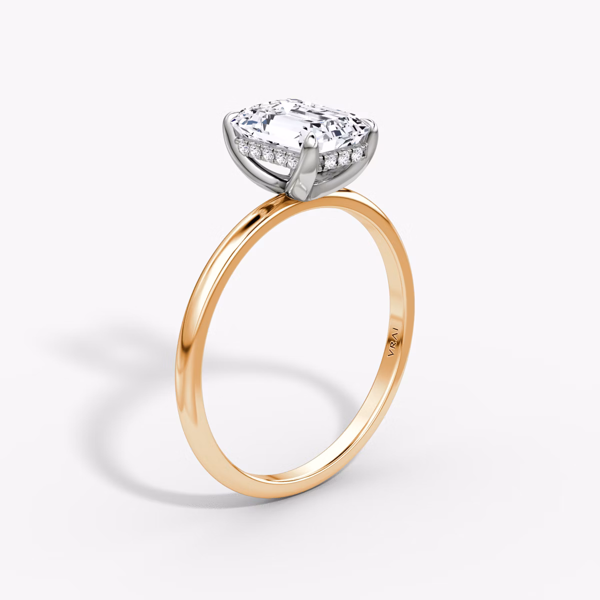 The Classic Hidden Halo | Emerald | 14k | Rose Gold and Platinum | bandAccent: Plain | bandWidth: standard | prongStyle: Plain | diamondOrientation: vertical | caratWeight: other