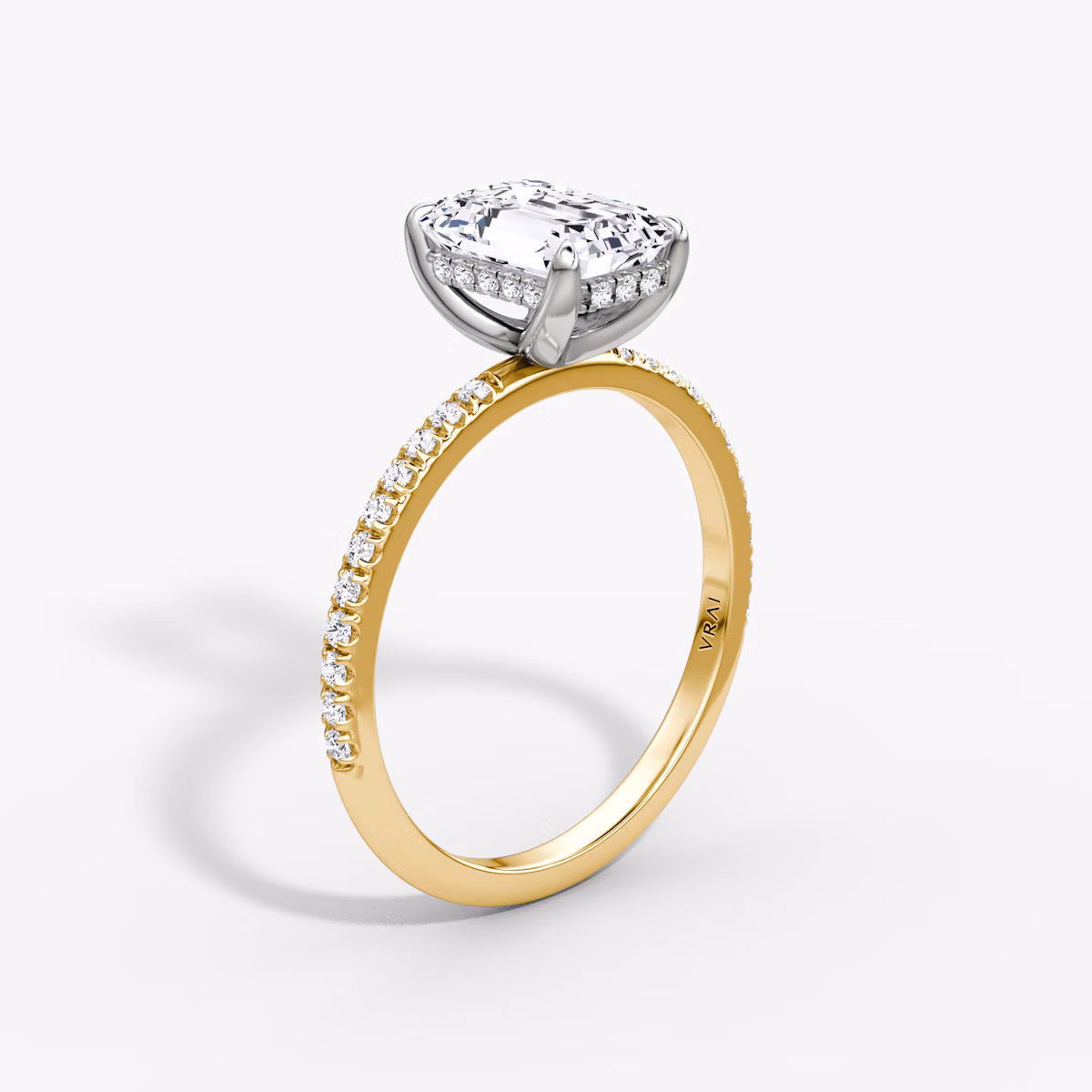 The Classic Hidden Halo | Emerald | 18k | Yellow Gold and Platinum | bandAccent: Pavé | bandWidth: standard | prongStyle: Plain | diamondOrientation: vertical | caratWeight: other