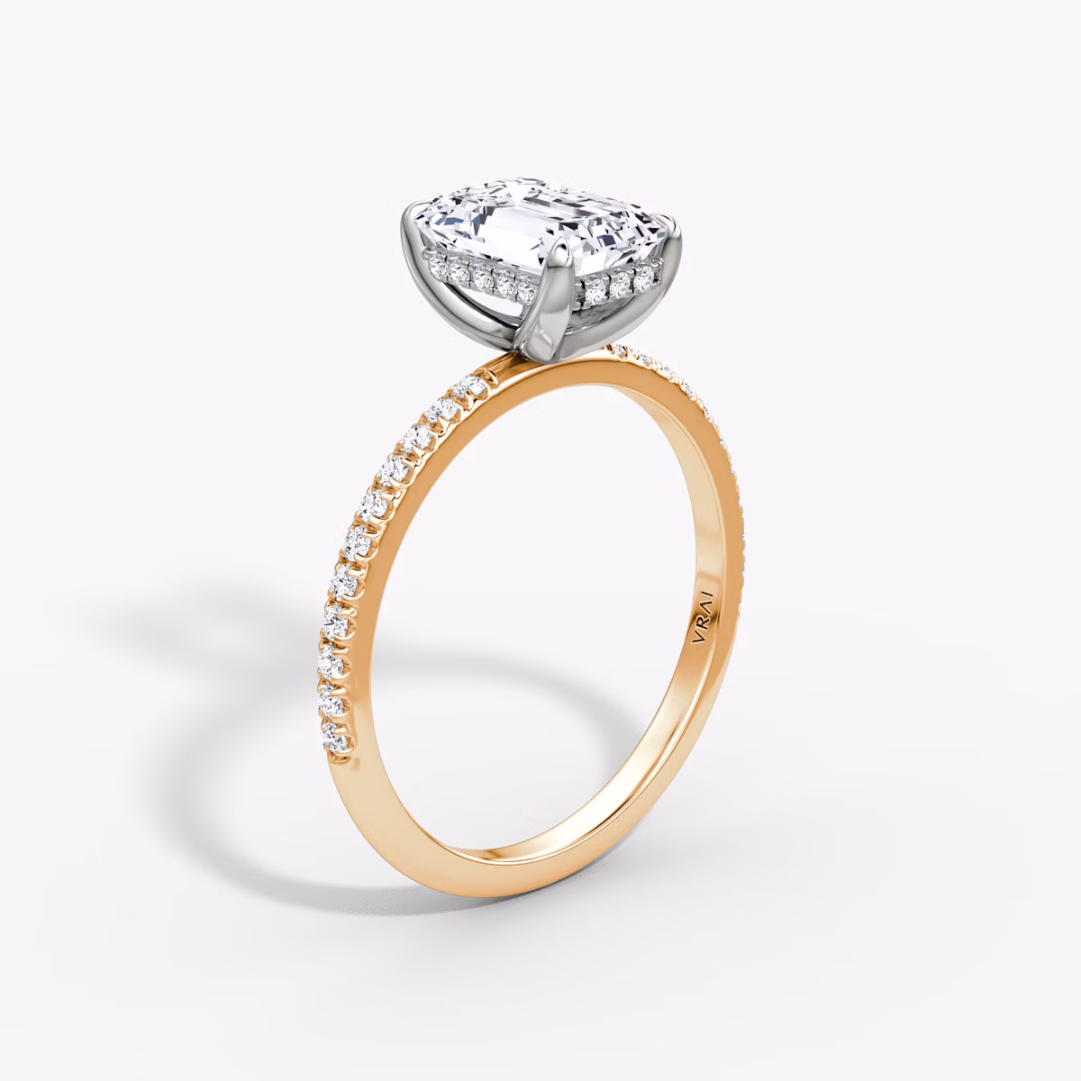 The Classic Hidden Halo | Emerald | 14k | Rose Gold and Platinum | bandAccent: Pavé | bandWidth: standard | prongStyle: Plain | diamondOrientation: vertical | caratWeight: other