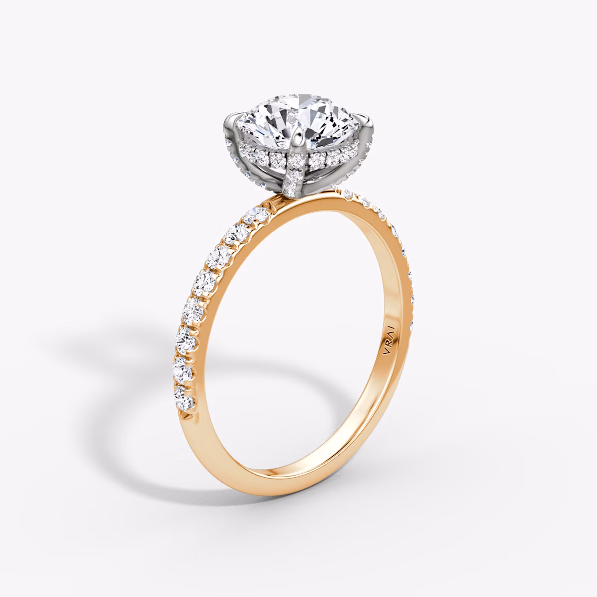 The Classic Hidden Halo | Round Brilliant | 14k | Rose Gold and Platinum | bandAccent: Pavé | bandWidth: large | caratWeight: other | prongStyle: Pavé | diamondOrientation: vertical