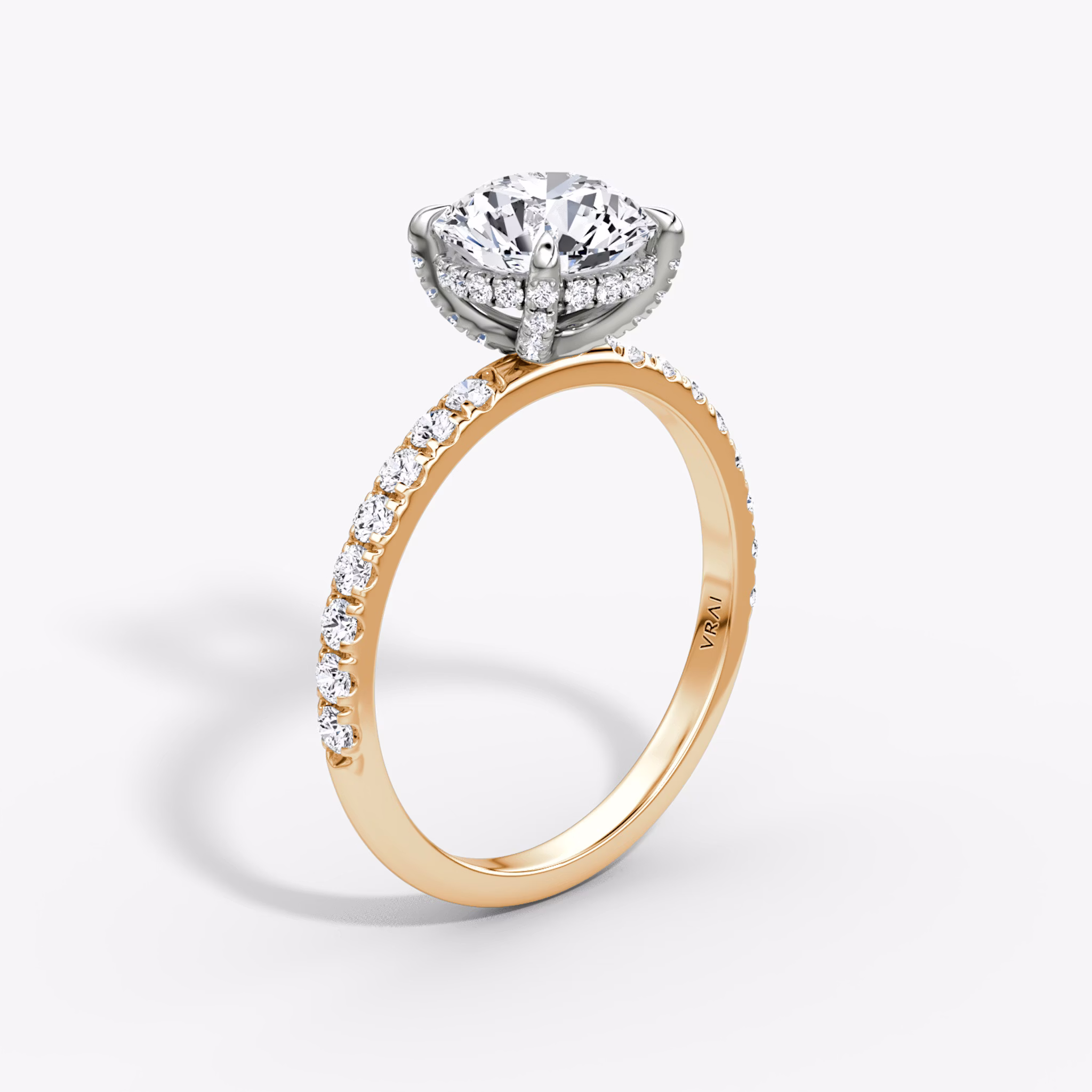 The Classic Hidden Halo | Round Brilliant | 14k | Rose Gold and Platinum | bandAccent: Pavé | bandWidth: large | caratWeight: other | prongStyle: Pavé | diamondOrientation: vertical