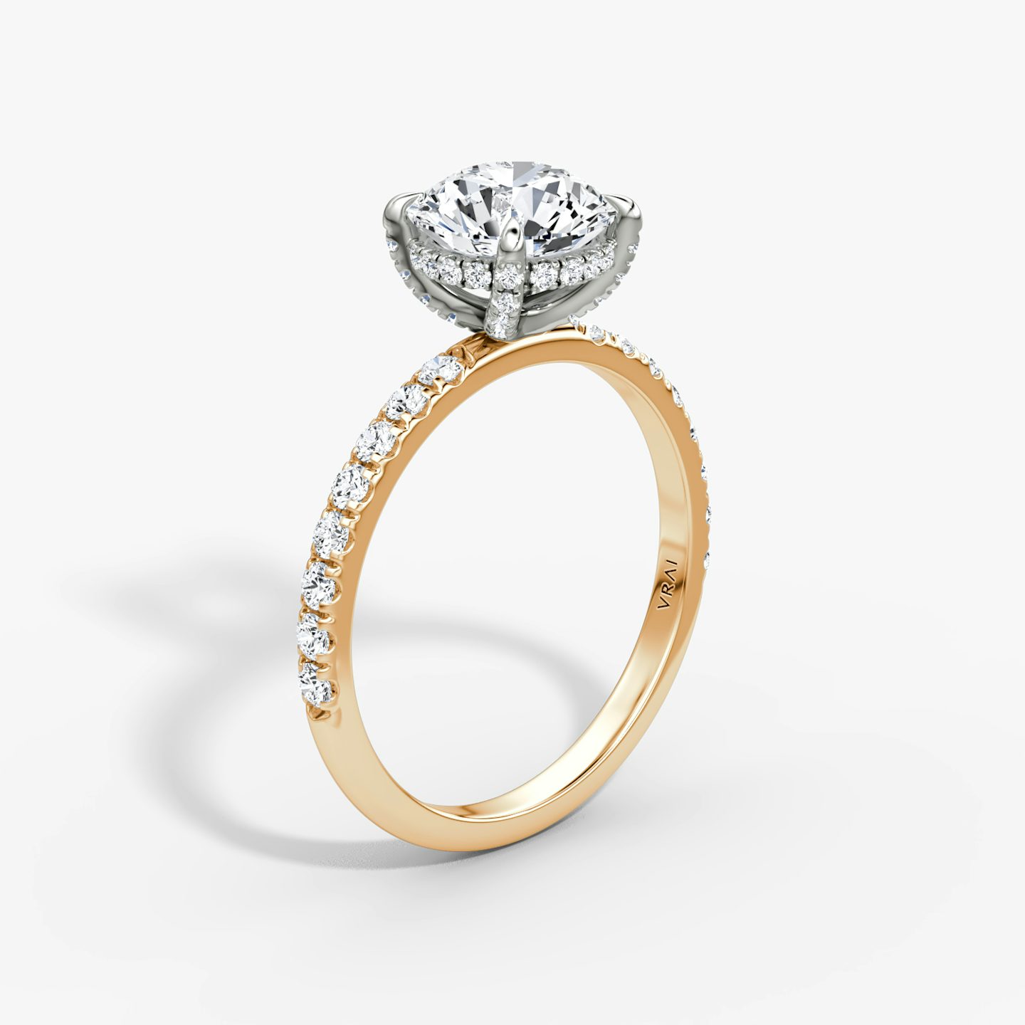 The Classic Hidden Halo | Round Brilliant | 14k | Rose Gold and Platinum | bandAccent: Pavé | bandWidth: large | caratWeight: 1.5ct | prongStyle: Pavé | diamondOrientation: vertical