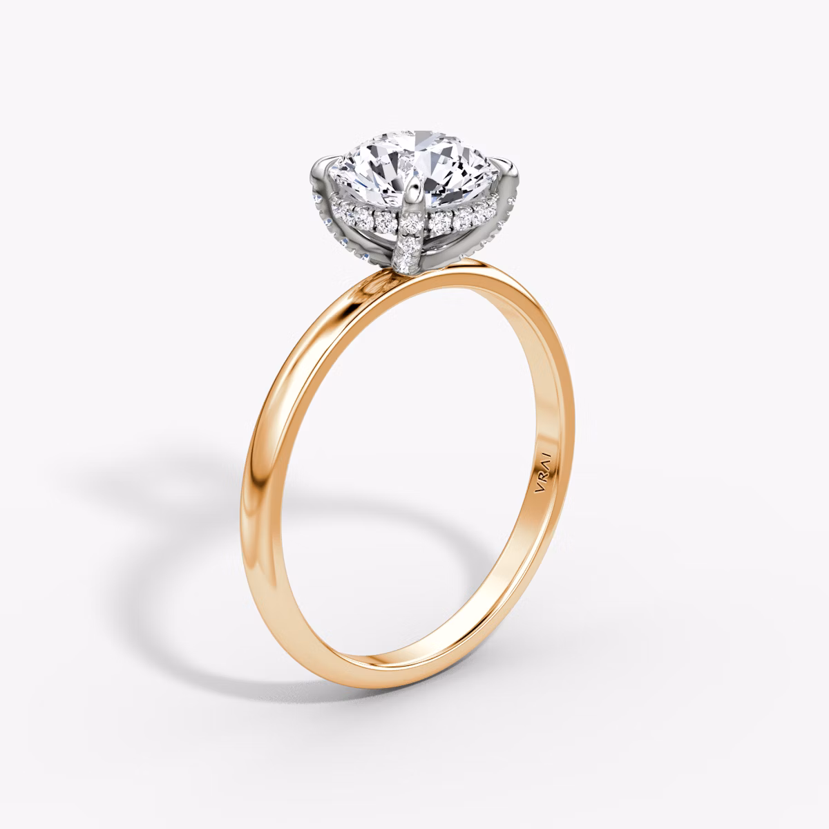 The Classic Hidden Halo | Round Brilliant | 14k | Rose Gold and Platinum | bandAccent: Plain | bandWidth: large | caratWeight: other | prongStyle: Pavé | diamondOrientation: vertical