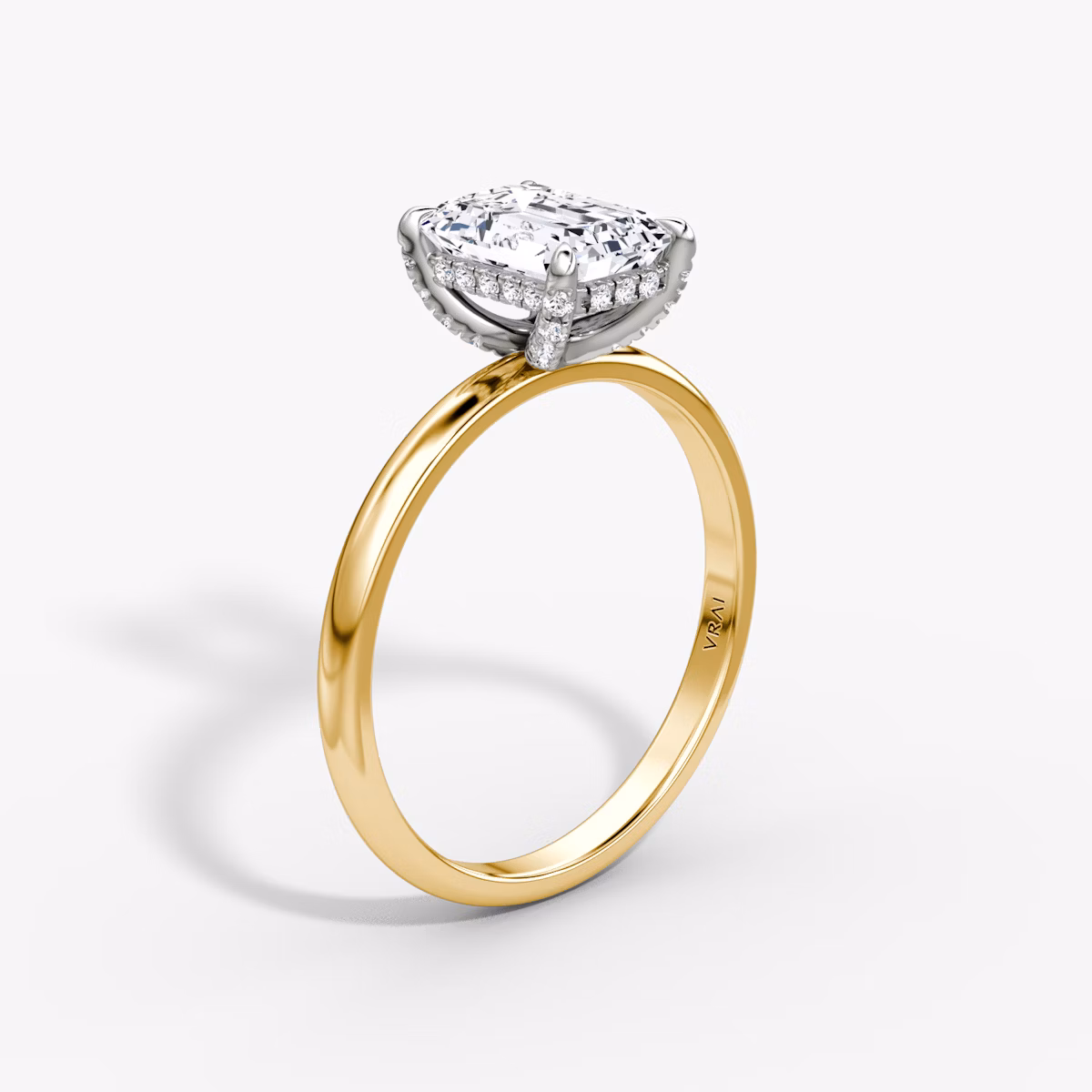The Classic Hidden Halo | Emerald | 18k | Yellow Gold and Platinum | bandAccent: Plain | bandWidth: large | prongStyle: Pavé | diamondOrientation: vertical | caratWeight: other