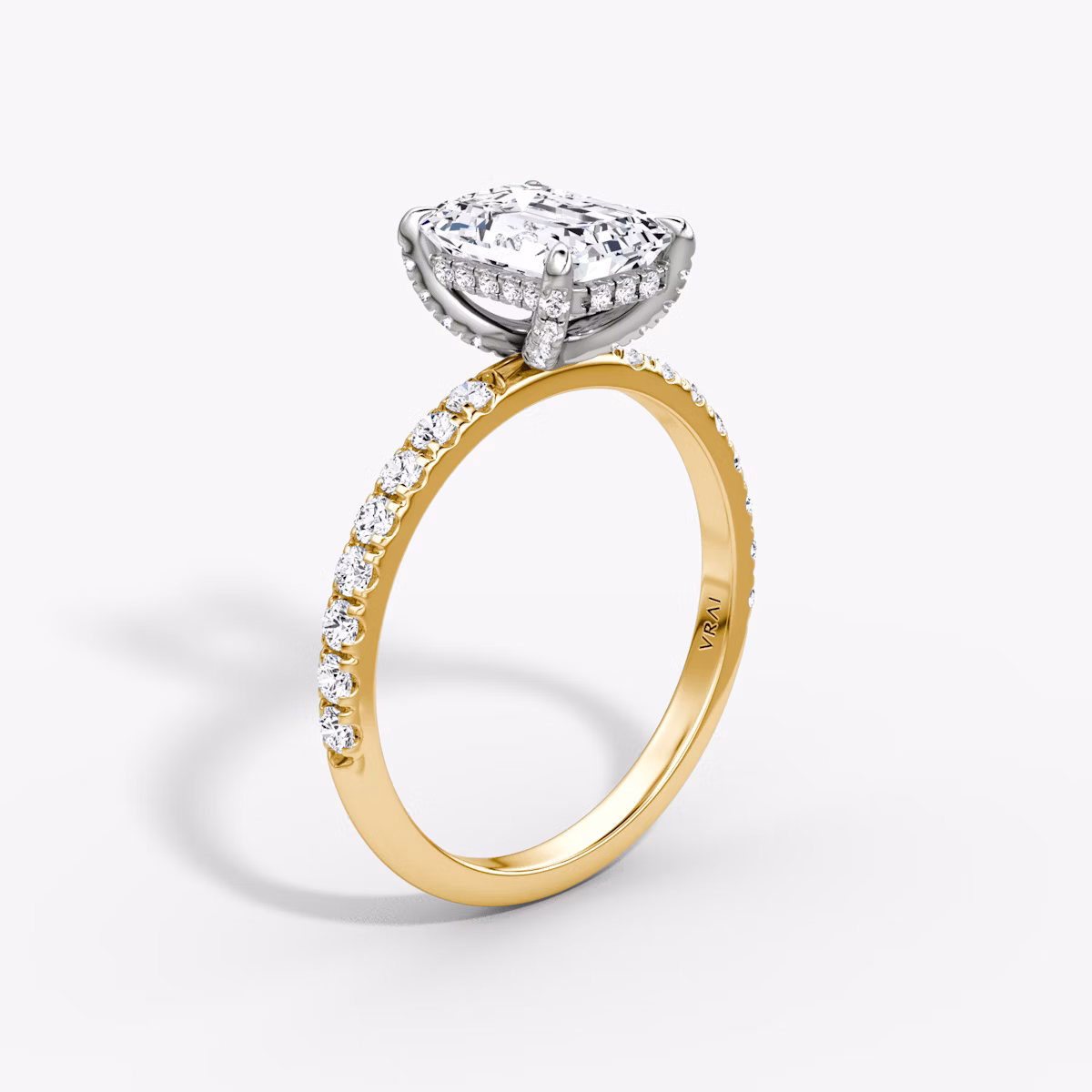 The Classic Hidden Halo | Emerald | 18k | Yellow Gold and Platinum | bandAccent: Pavé | bandWidth: large | prongStyle: Pavé | diamondOrientation: vertical | caratWeight: other
