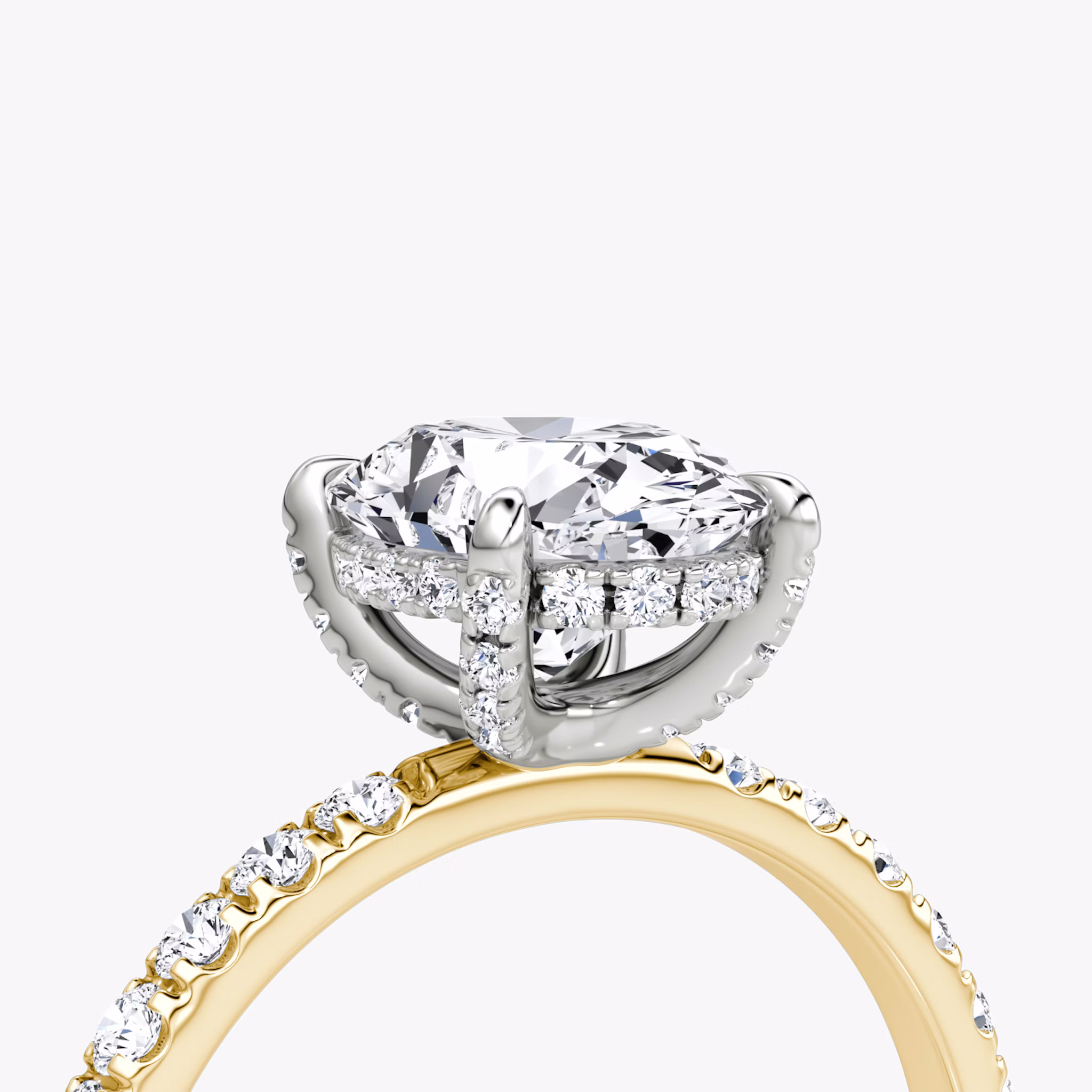 The Classic Hidden Halo | Oval | 18k | Yellow Gold and Platinum | bandAccent: Pavé | bandWidth: large | prongStyle: Pavé | diamondOrientation: vertical | caratWeight: other