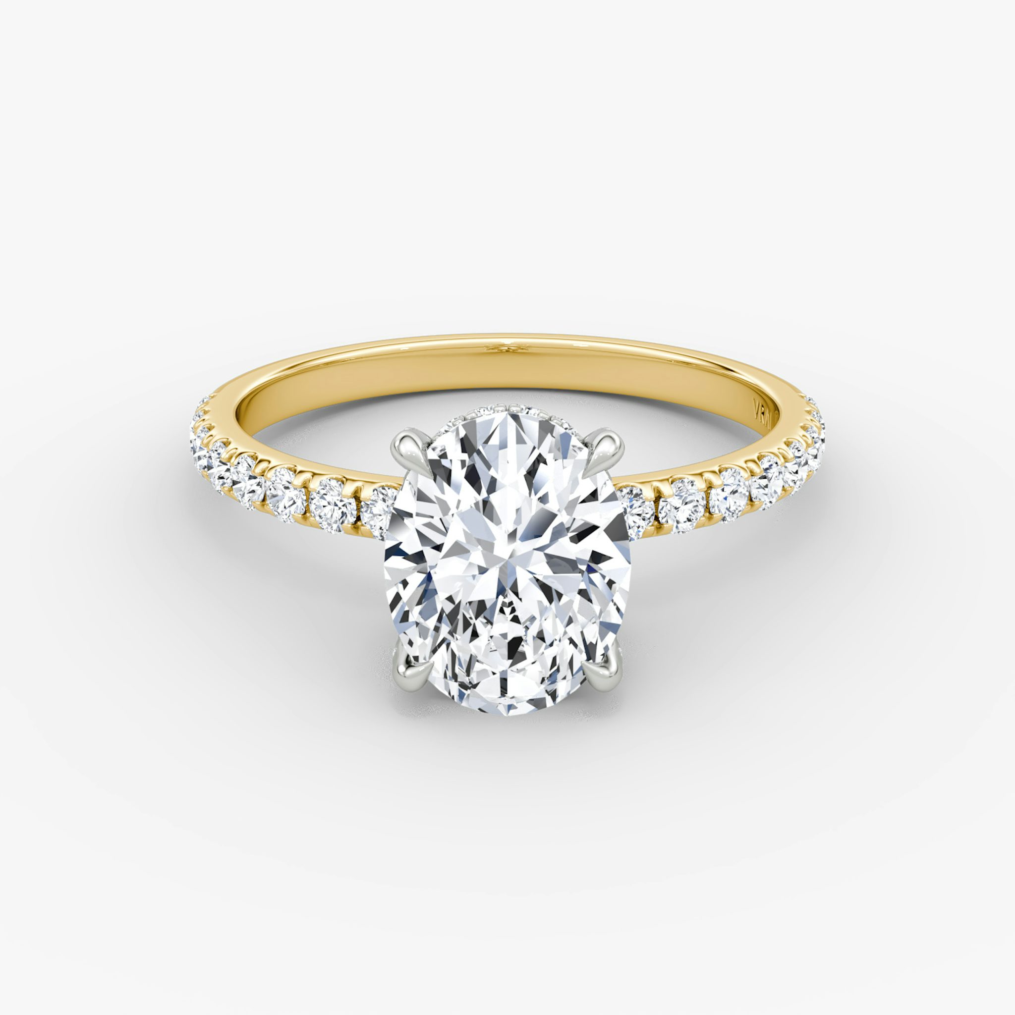 The Classic Hidden Halo | Oval | 18k | Yellow Gold and Platinum | bandAccent: Pavé | bandWidth: large | prongStyle: Pavé | diamondOrientation: vertical | caratWeight: other