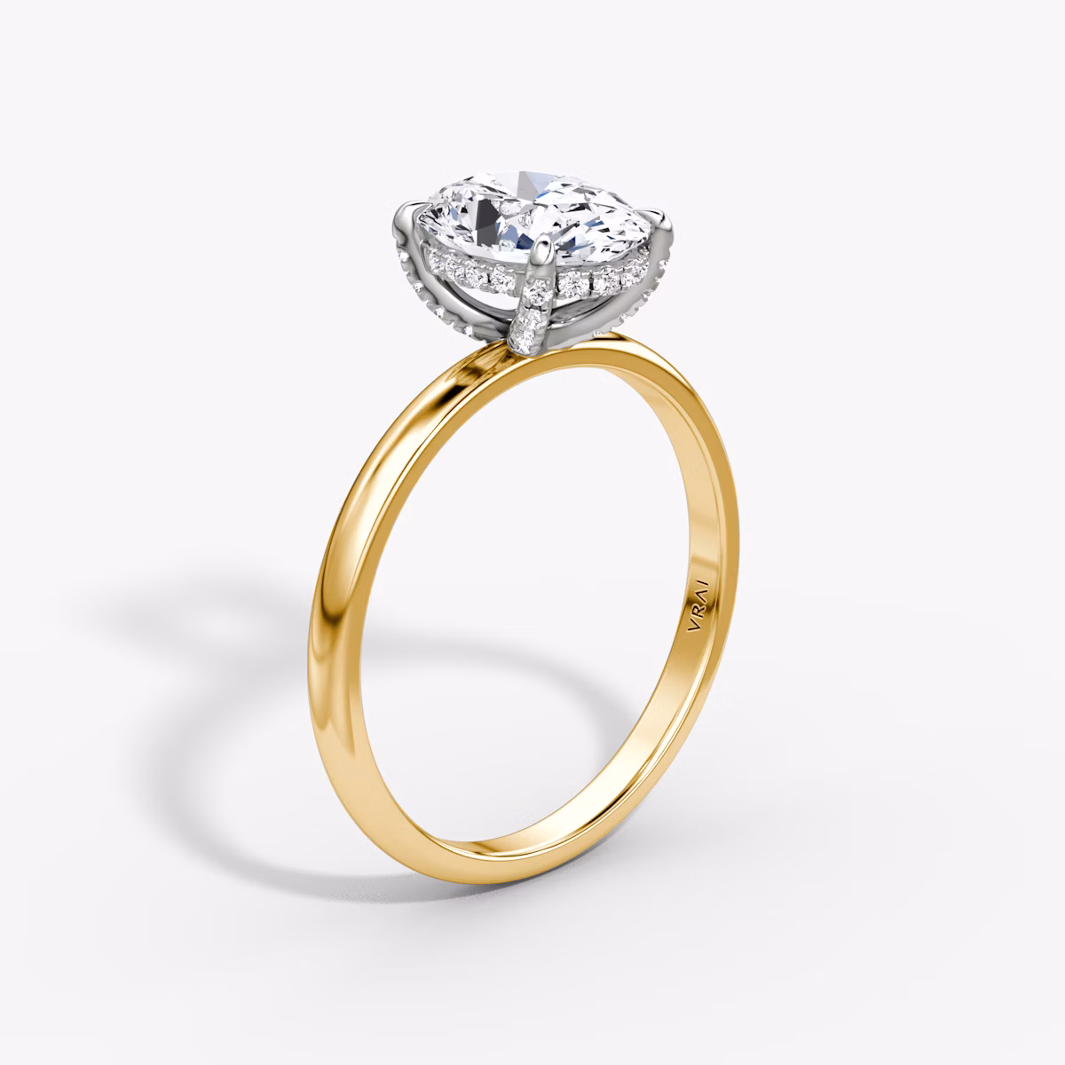 The Classic Hidden Halo | Oval | 18k | Yellow Gold and Platinum | bandAccent: Plain | bandWidth: large | prongStyle: Pavé | diamondOrientation: vertical | caratWeight: other