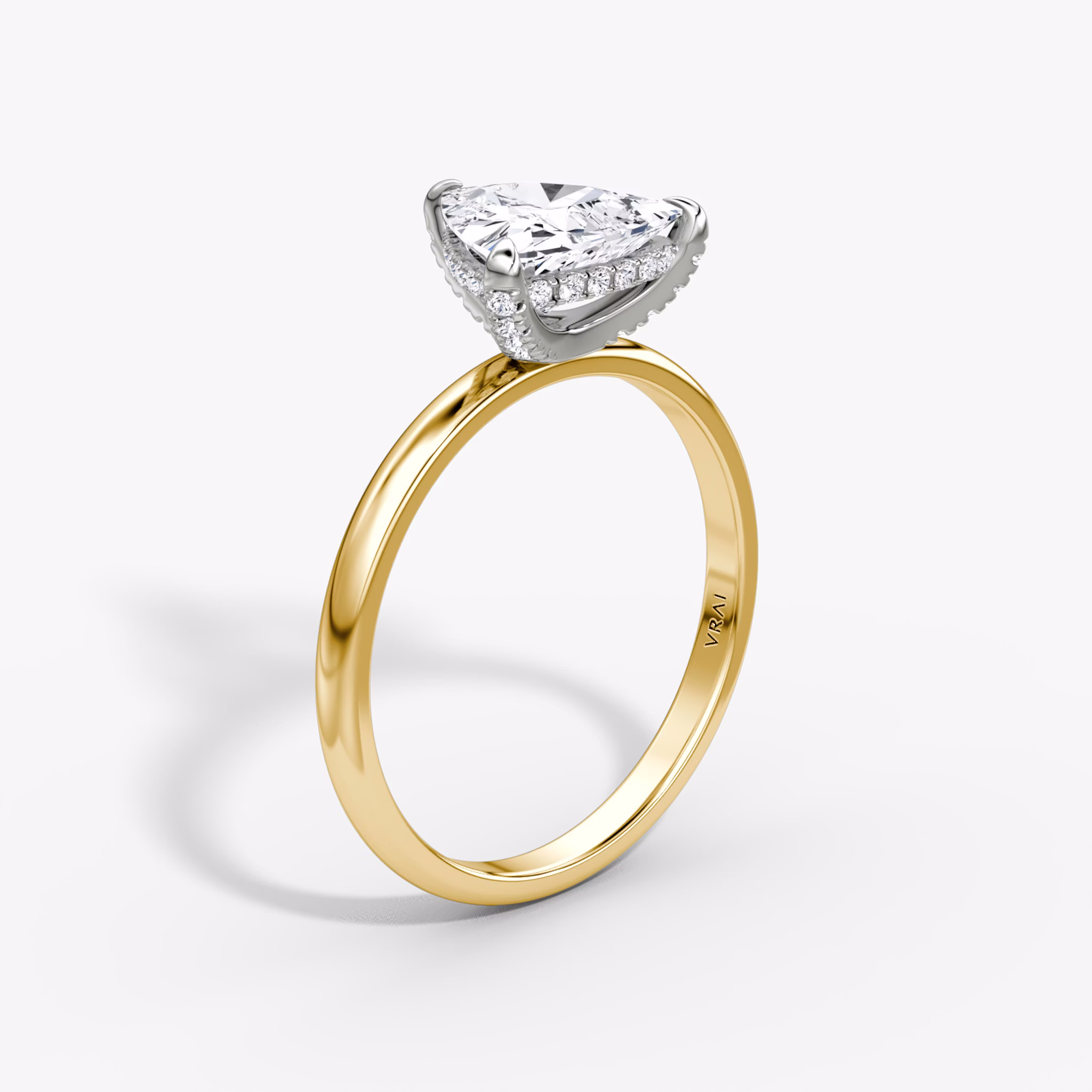 The Classic Hidden Halo | Trillion | 18k | Yellow Gold and Platinum | bandAccent: Plain | bandWidth: large | prongStyle: Pavé | diamondOrientation: vertical | caratWeight: other