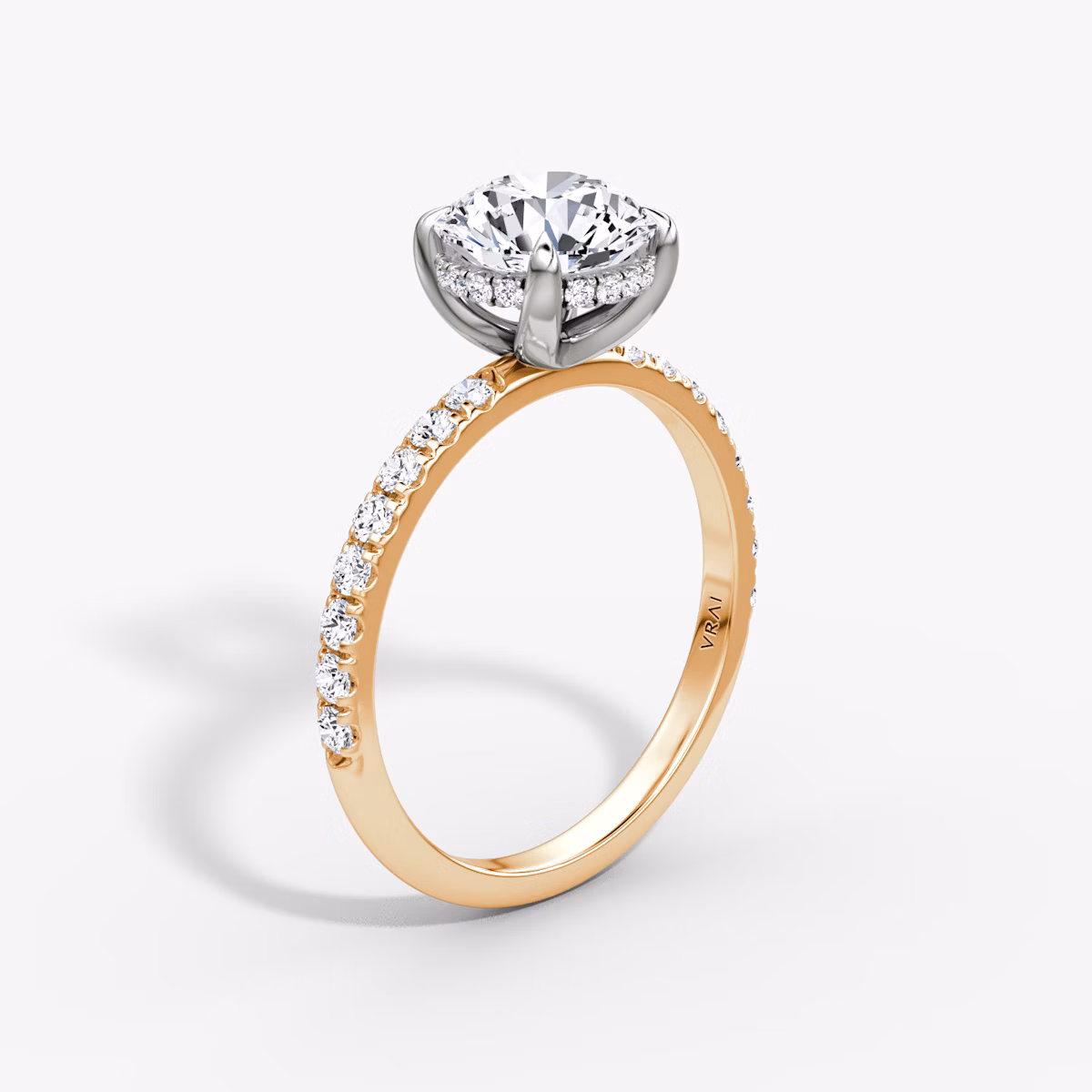 The Classic Hidden Halo | Round Brilliant | 14k | Rose Gold and Platinum | bandAccent: Pavé | bandWidth: large | caratWeight: 1.5ct | prongStyle: Plain | diamondOrientation: vertical