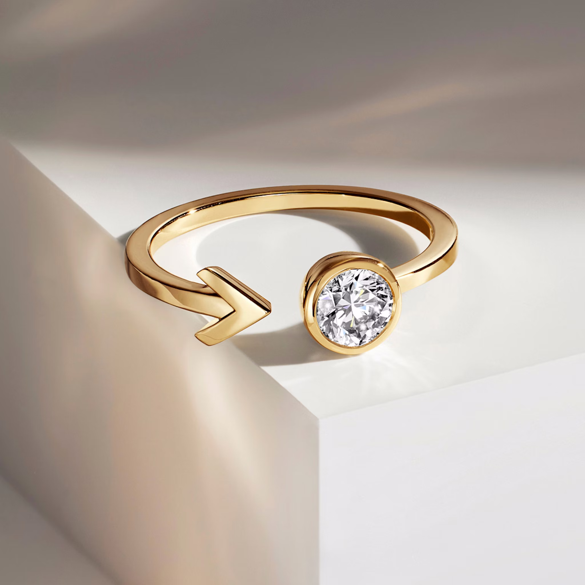 Yellow gold ring laying on table