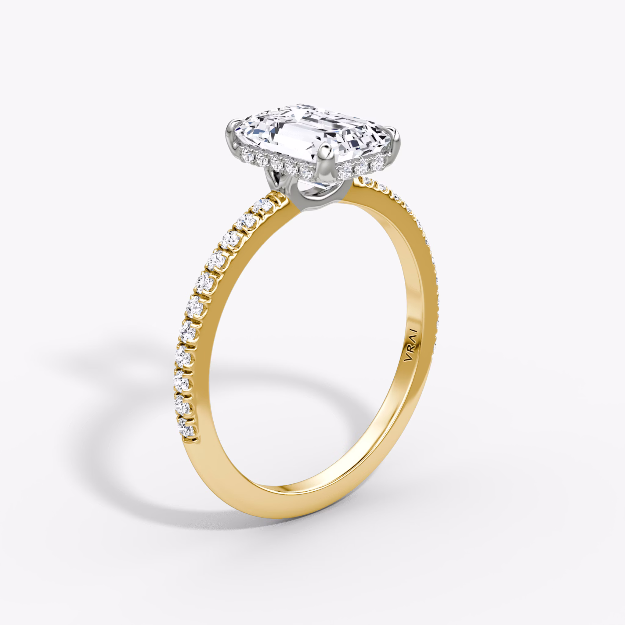 The Signature | Emerald | 18k | Yellow Gold and Platinum | bandAccent: Pavé | bandWidth: standard | hiddenHalo: yes | diamondOrientation: vertical | caratWeight: other