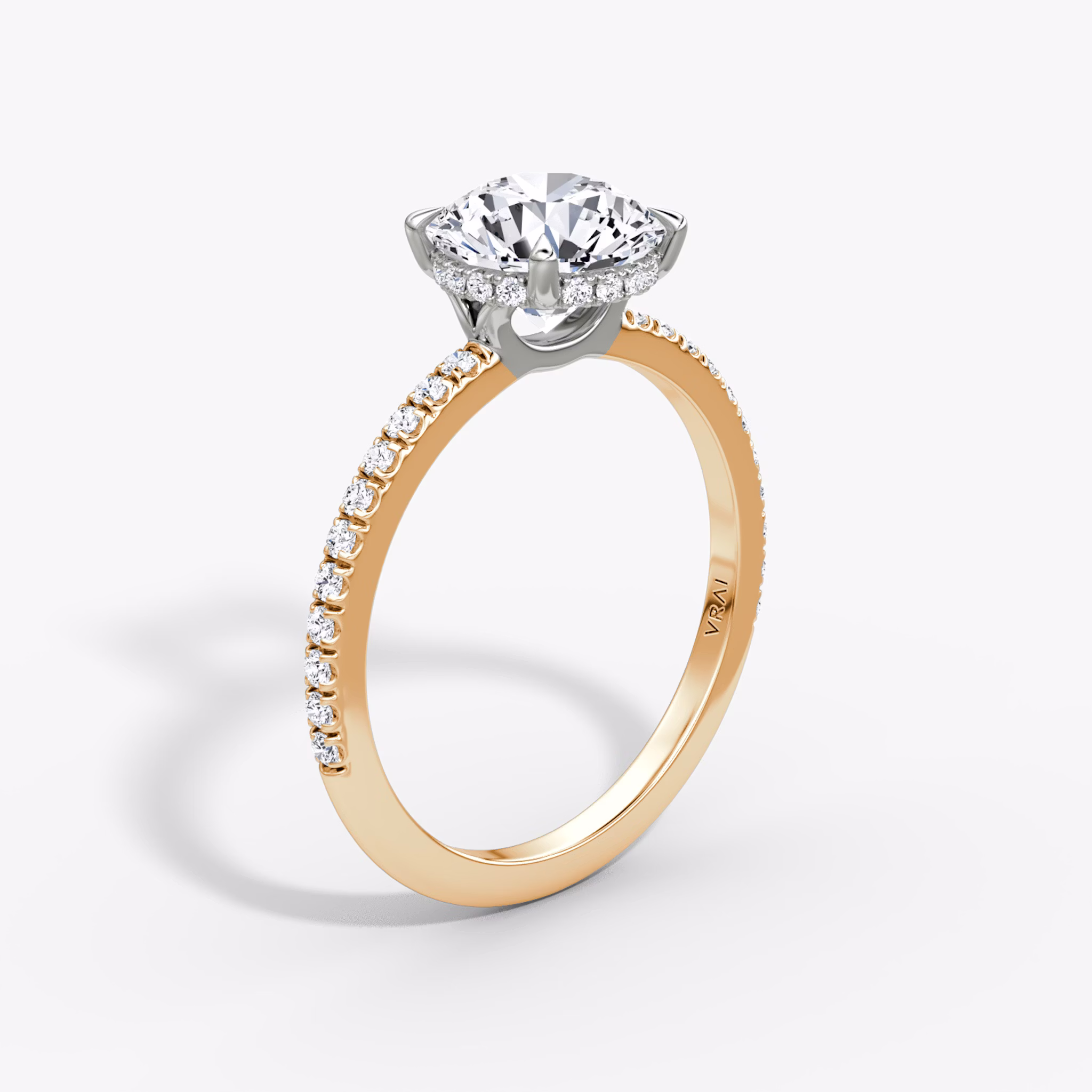 The Signature | Round Brilliant | 14k | Rose Gold and Platinum | bandAccent: Pavé | bandWidth: standard | caratWeight: 1.5ct | hiddenHalo: yes | diamondOrientation: vertical