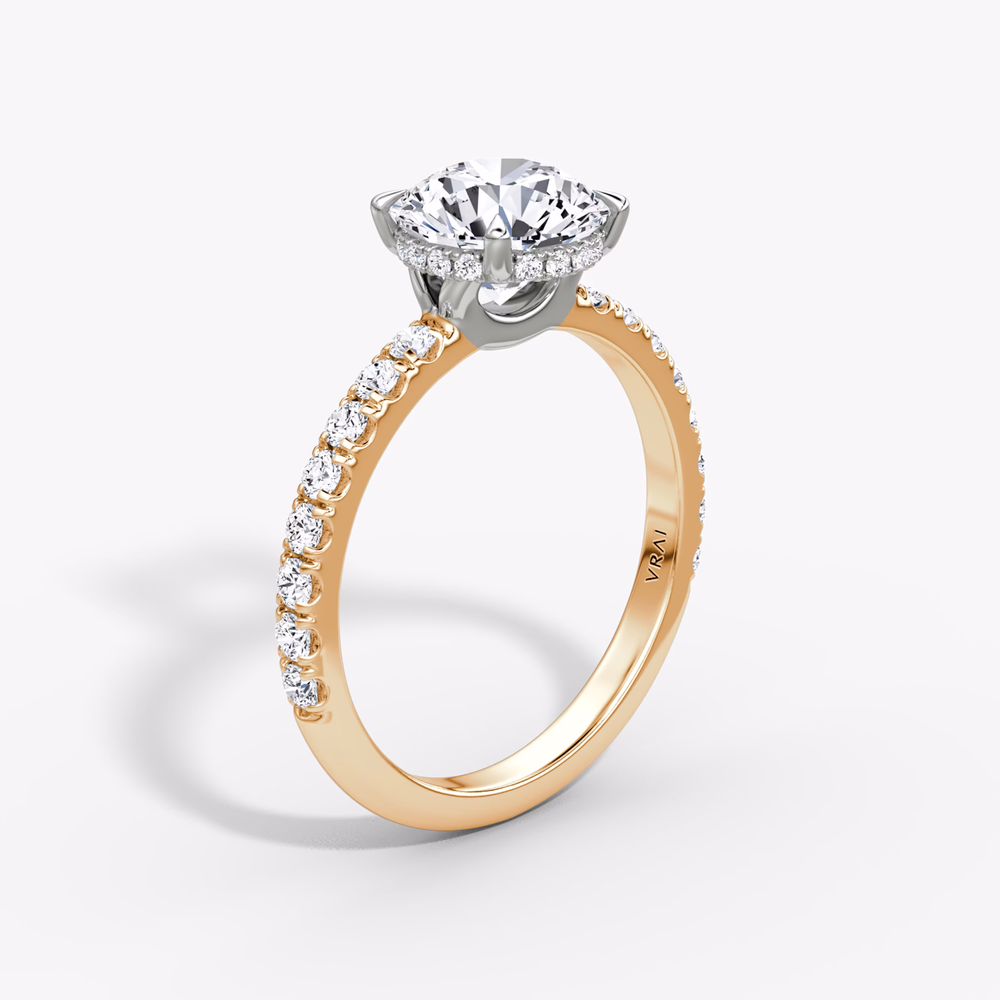 The Signature | Round Brilliant | 14k | Rose Gold and Platinum | bandAccent: Pavé | bandWidth: large | caratWeight: 1.0ct | hiddenHalo: yes | diamondOrientation: vertical