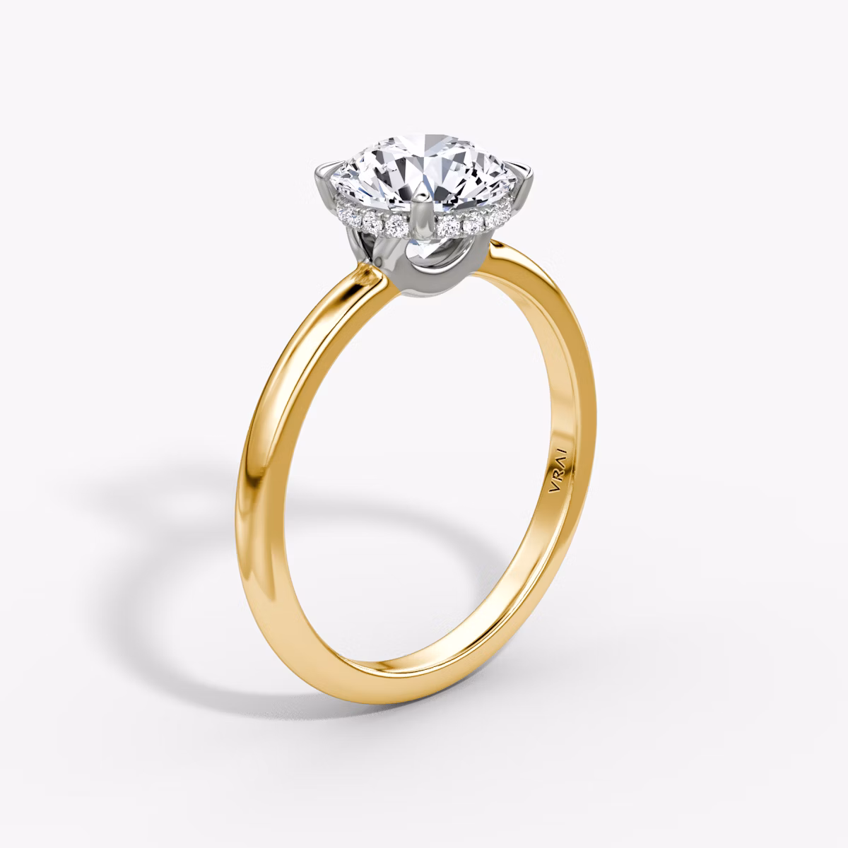 The Signature | Round Brilliant | 18k | Yellow Gold and Platinum | bandAccent: Plain | bandWidth: large | caratWeight: 1.5ct | hiddenHalo: yes | diamondOrientation: vertical