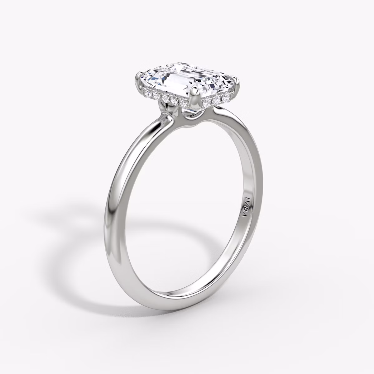The Signature | Emerald | Platinum | bandAccent: Plain | bandWidth: large | hiddenHalo: yes | diamondOrientation: vertical | caratWeight: other