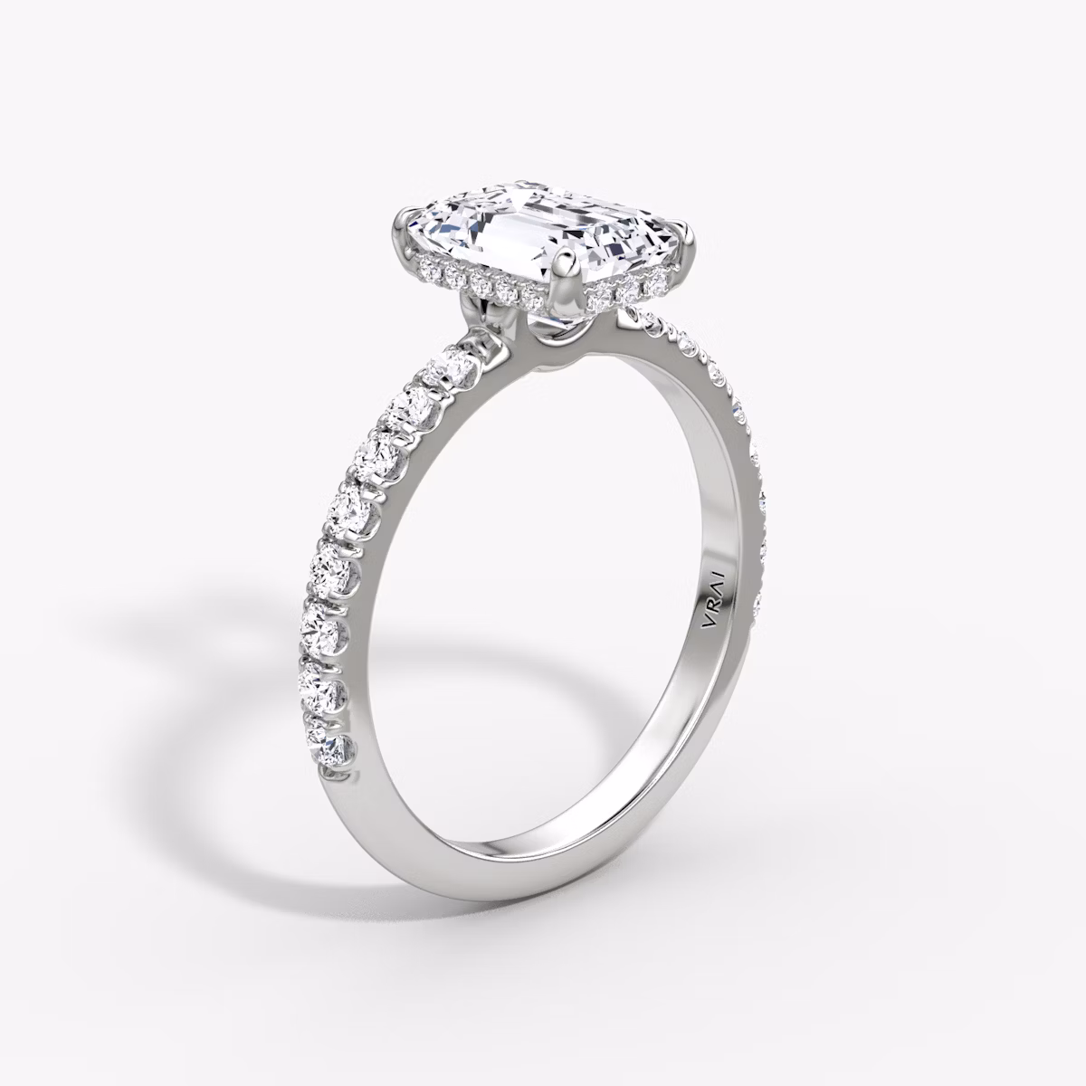 The Signature | Emerald | 18k | White Gold | bandAccent: Pavé | bandWidth: large | hiddenHalo: yes | diamondOrientation: vertical | caratWeight: other
