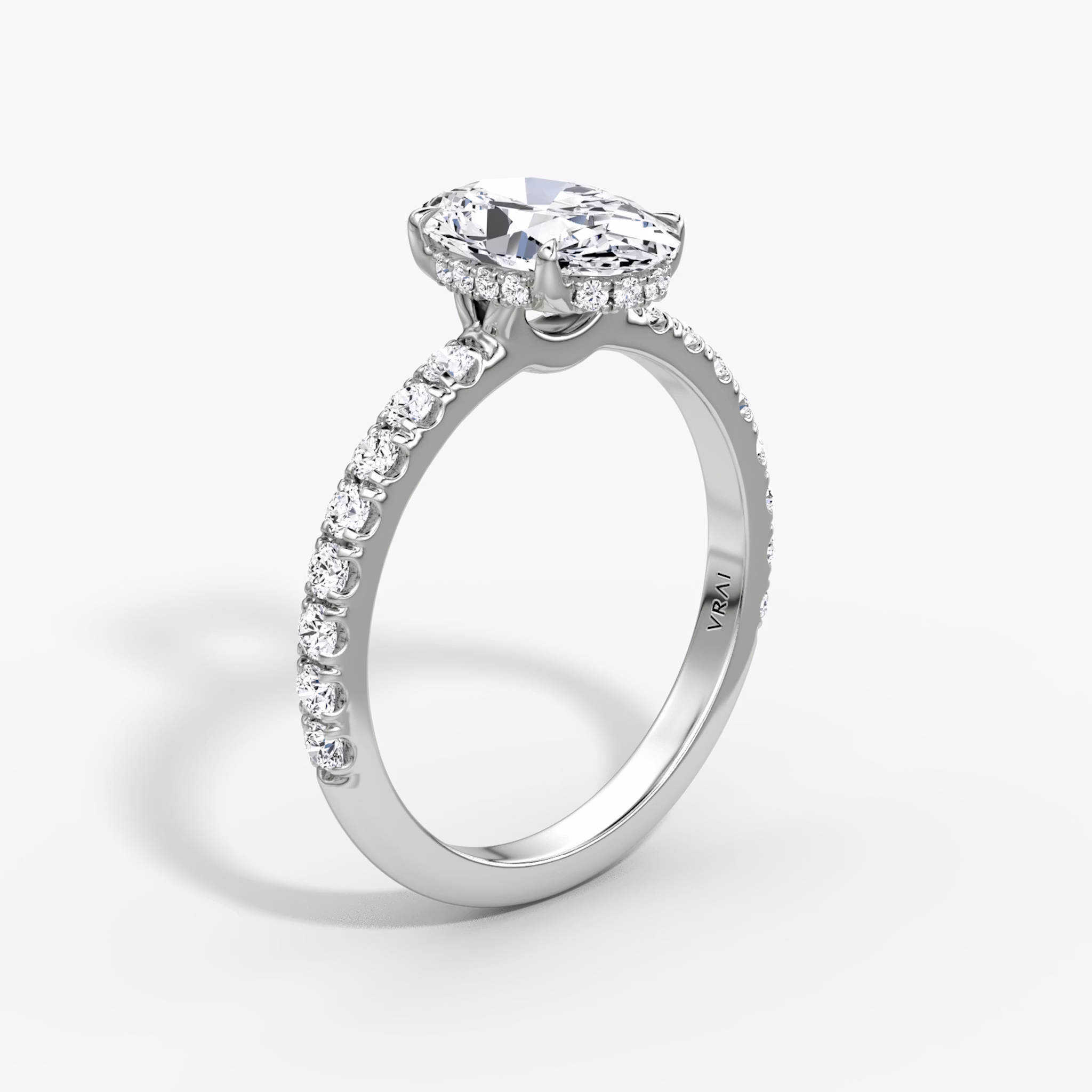 The Signature | Oval | 18k | White Gold | bandAccent: Pavé | bandWidth: large | hiddenHalo: yes | diamondOrientation: vertical | caratWeight: other
