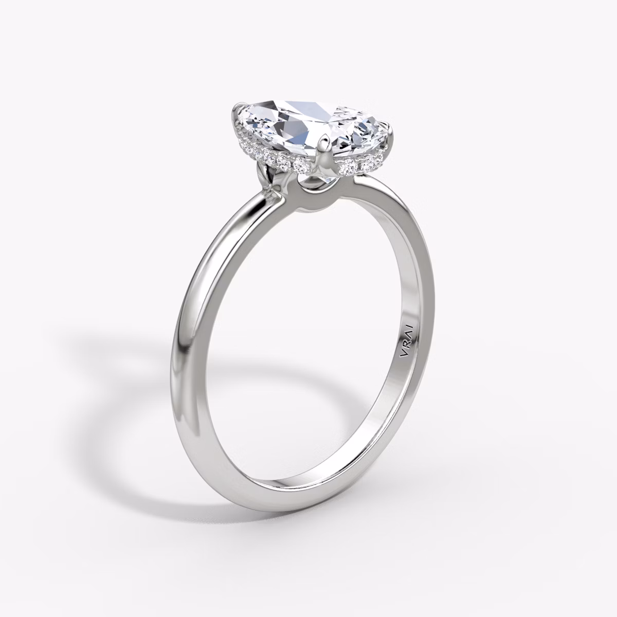 The Signature | Pear | 18k | White Gold | bandAccent: Plain | bandWidth: large | hiddenHalo: yes | diamondOrientation: vertical | caratWeight: other