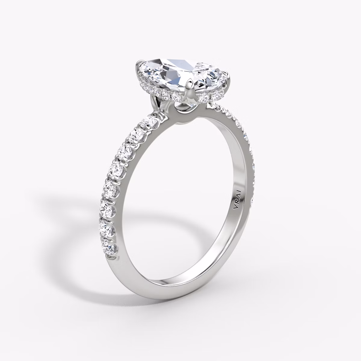 The Signature | Pear | 18k | White Gold | bandAccent: Pavé | bandWidth: large | hiddenHalo: yes | diamondOrientation: vertical | caratWeight: other
