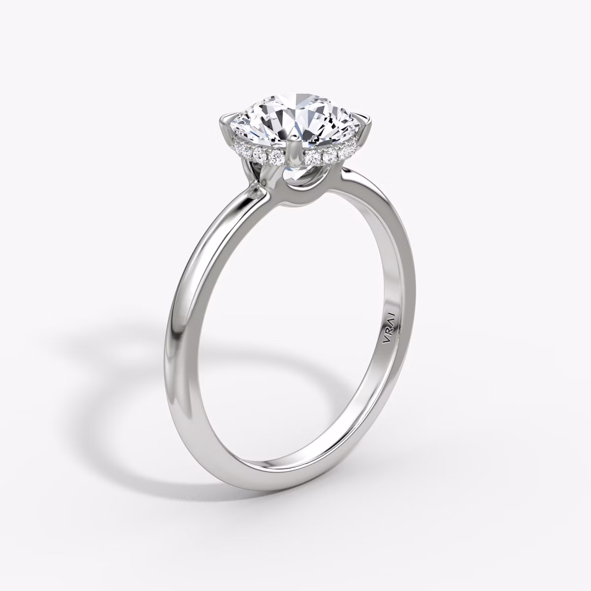 The Signature | Round Brilliant | Platinum | bandAccent: Plain | bandWidth: large | caratWeight: 1.5ct | hiddenHalo: yes | diamondOrientation: vertical