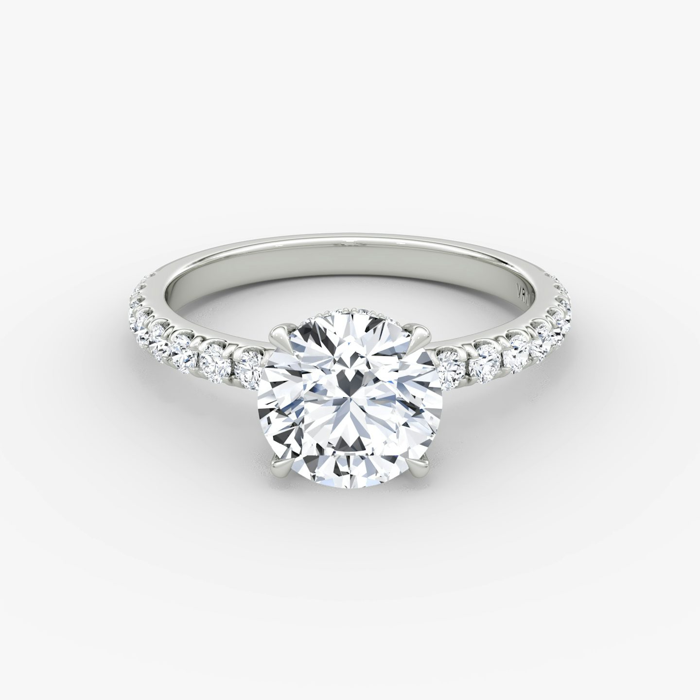 The Signature | Round Brilliant | Platinum | bandAccent: Pavé | bandWidth: large | caratWeight: other | hiddenHalo: yes | diamondOrientation: vertical