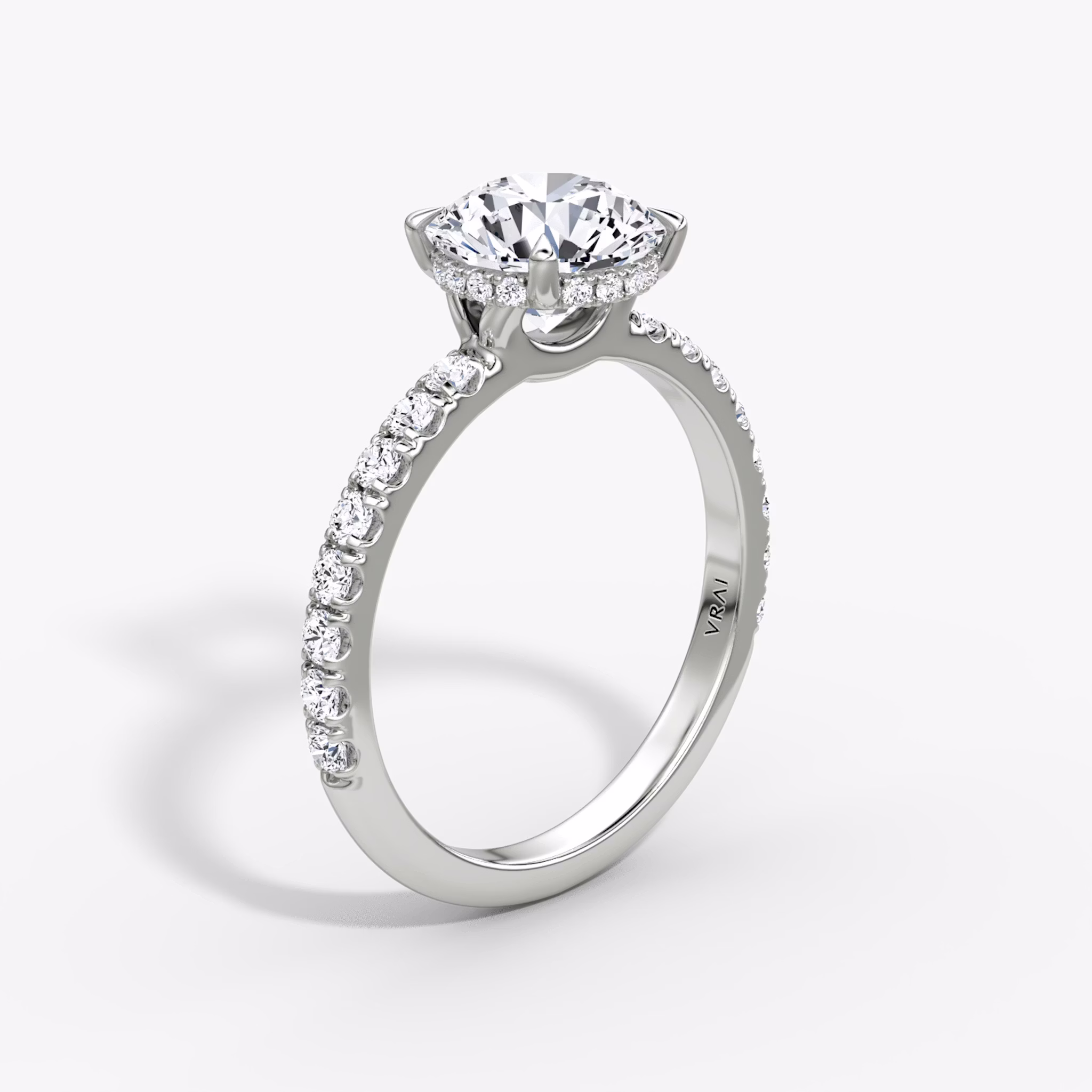 The Signature | Round Brilliant | 18k | White Gold | bandAccent: Pavé | bandWidth: large | caratWeight: other | hiddenHalo: yes | diamondOrientation: vertical
