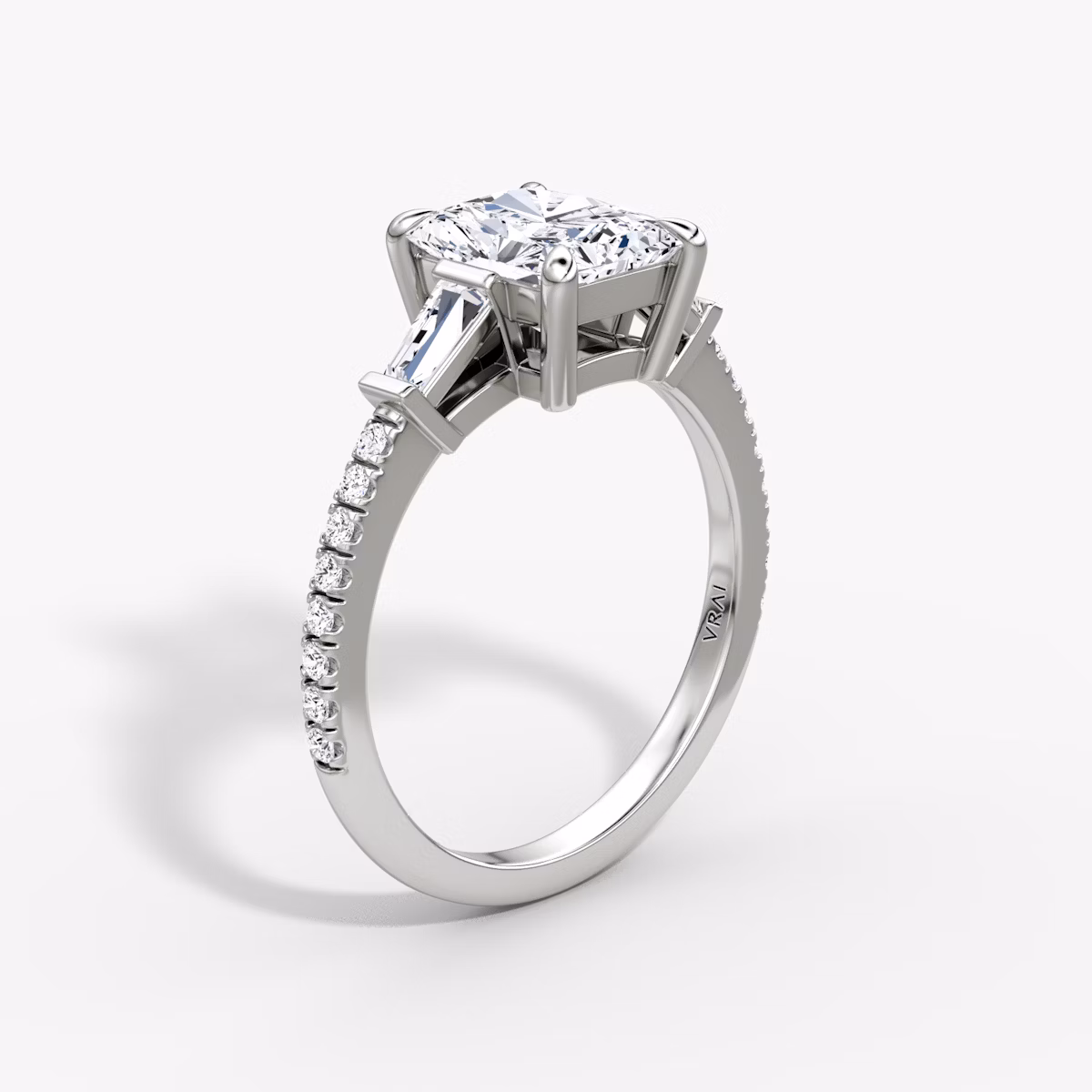 The Tapered Baguette Three Stone | Radiant | 18k | White Gold | bandAccent: Pavé | caratWeight: 1.0ct | excludeFromFeed: null | diamondOrientation: vertical