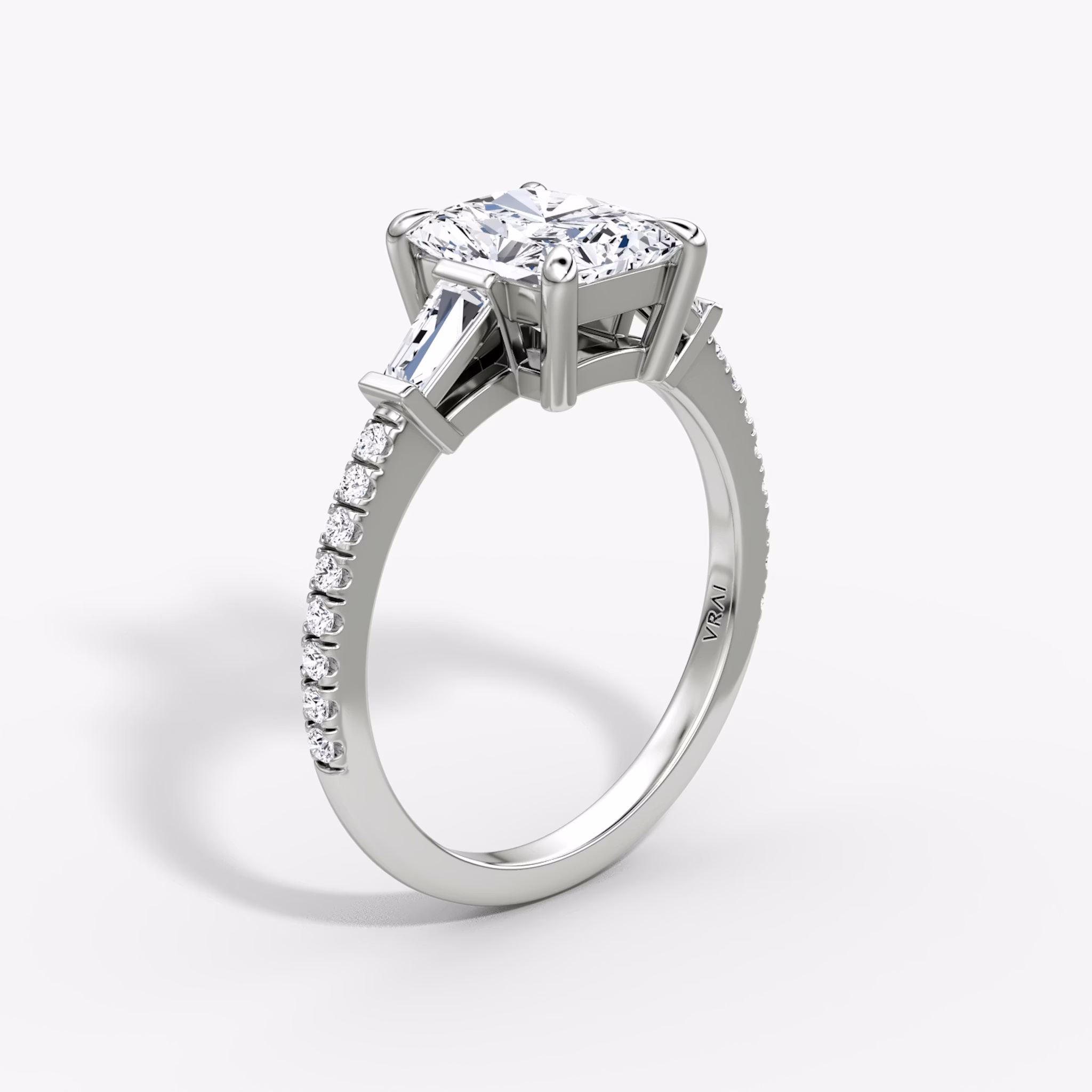 The Tapered Baguette Three Stone | Radiant | 18k | White Gold | bandAccent: Pavé | excludeFromFeed: null | diamondOrientation: vertical | caratWeight: other