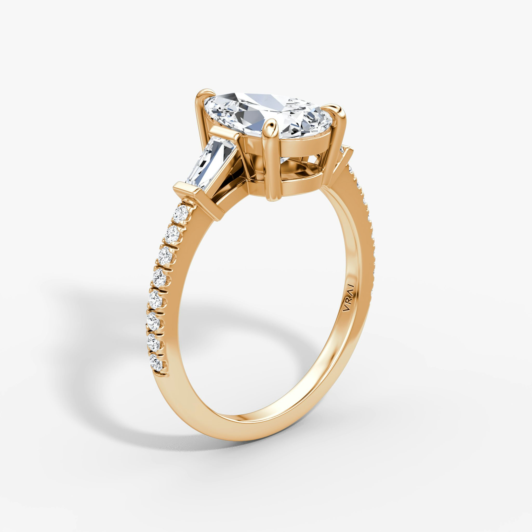The Tapered Baguette Three Stone | Pear | 14k | Rose Gold | bandAccent: Pavé | excludeFromFeed: null | diamondOrientation: vertical | caratWeight: other