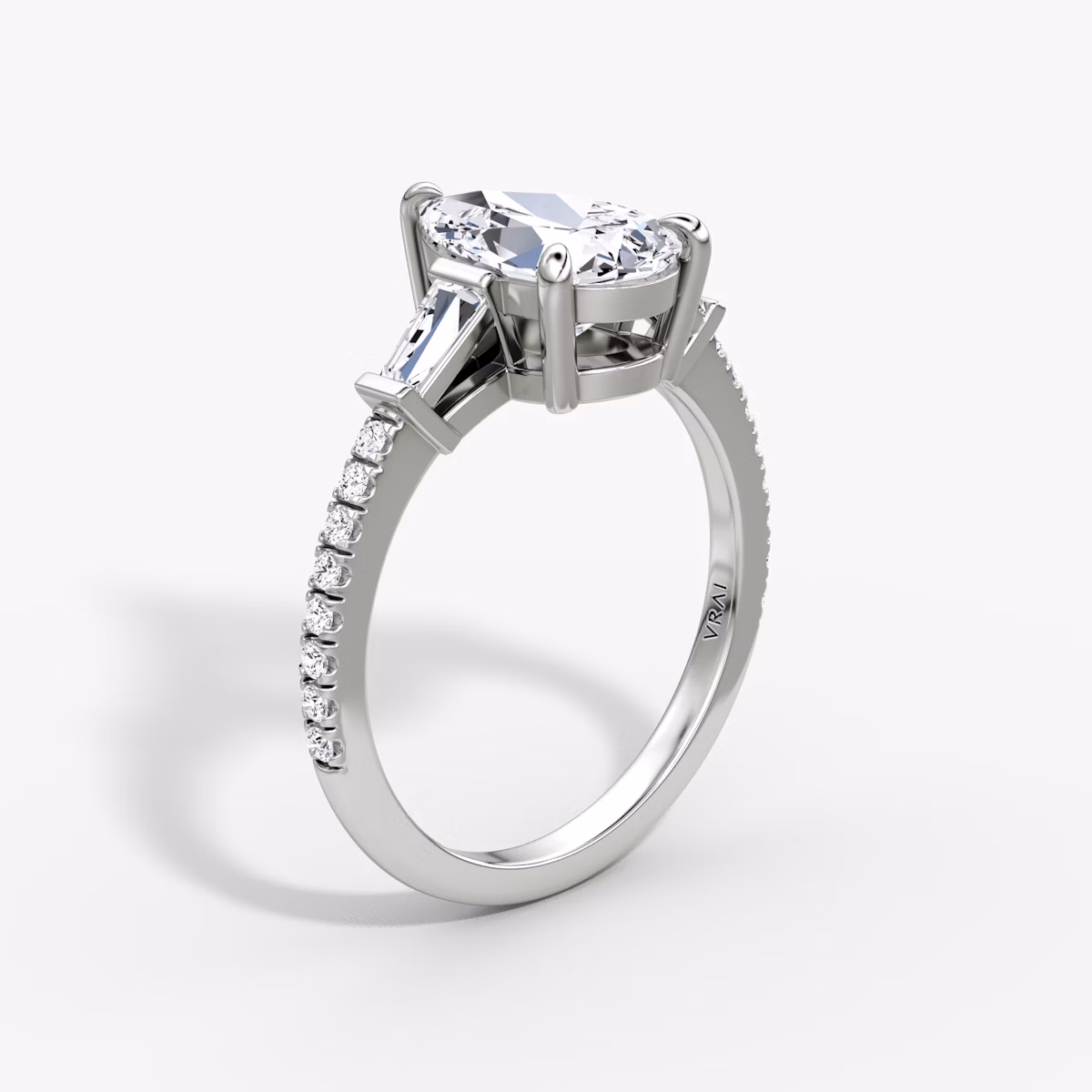 The Tapered Baguette Three Stone | Pear | 18k | White Gold | bandAccent: Pavé | caratWeight: 1.0ct | excludeFromFeed: null | diamondOrientation: vertical