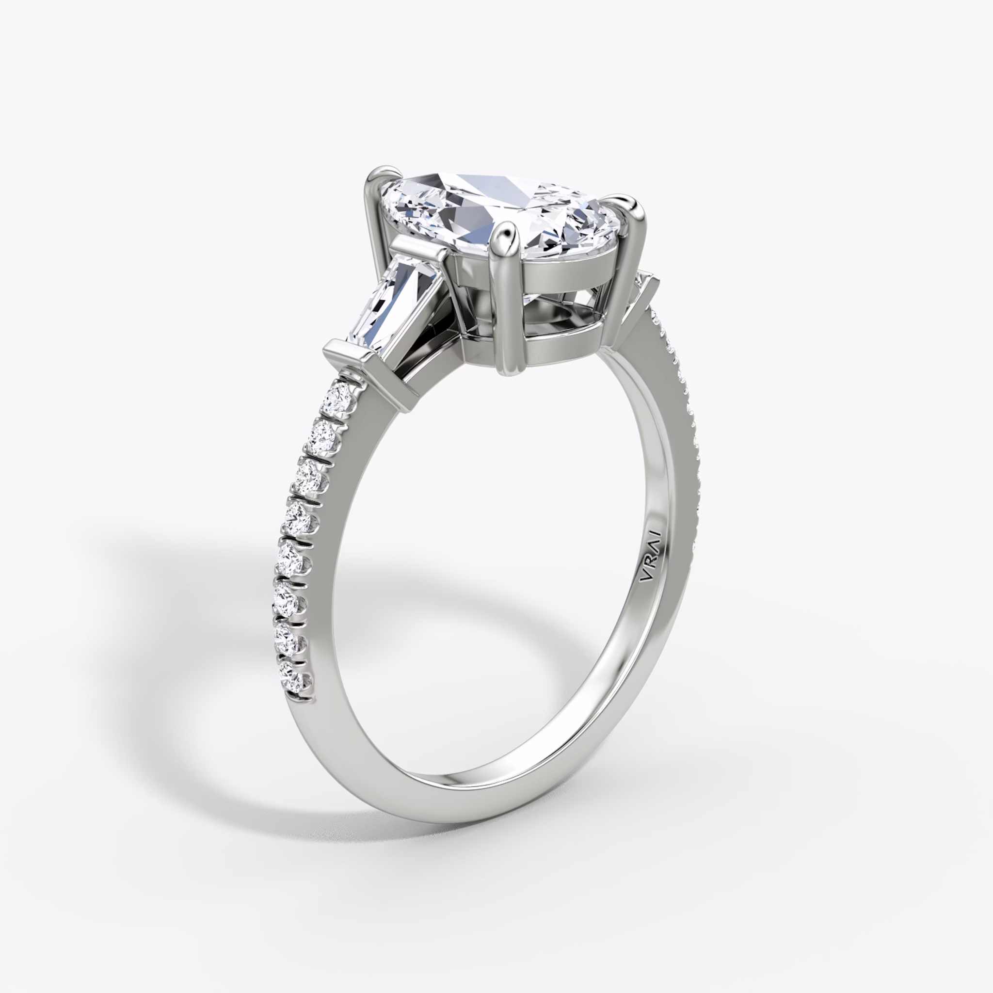 The Tapered Baguette Three Stone | Pear | 18k | White Gold | bandAccent: Pavé | excludeFromFeed: null | diamondOrientation: vertical | caratWeight: other