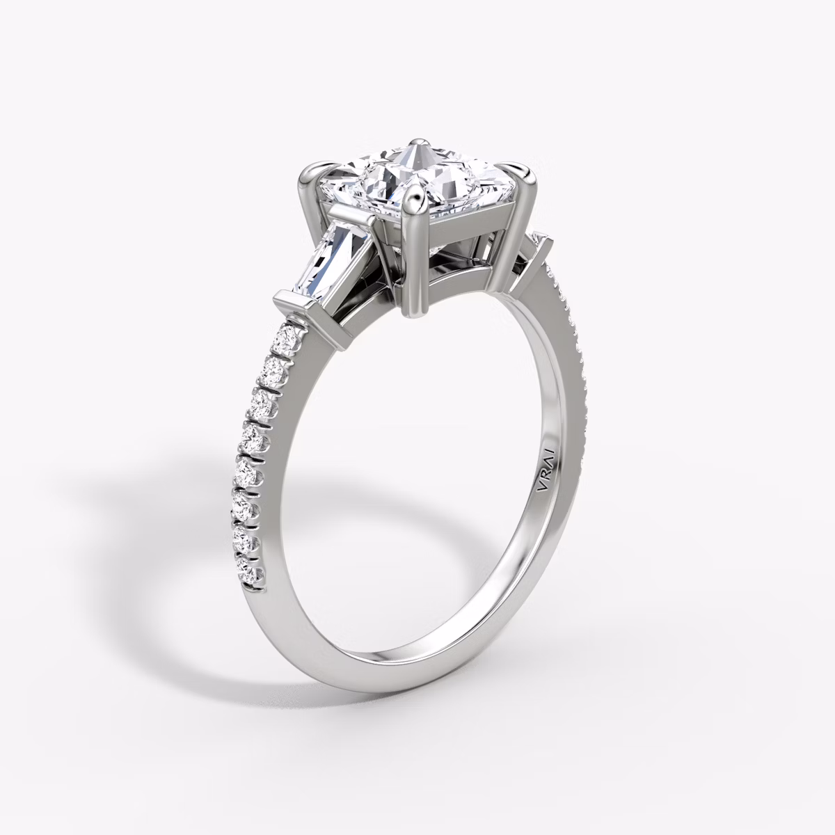 The Tapered Baguette Three Stone | Princess | Platinum | bandAccent: Pavé | caratWeight: 1.0ct | excludeFromFeed: null | diamondOrientation: vertical