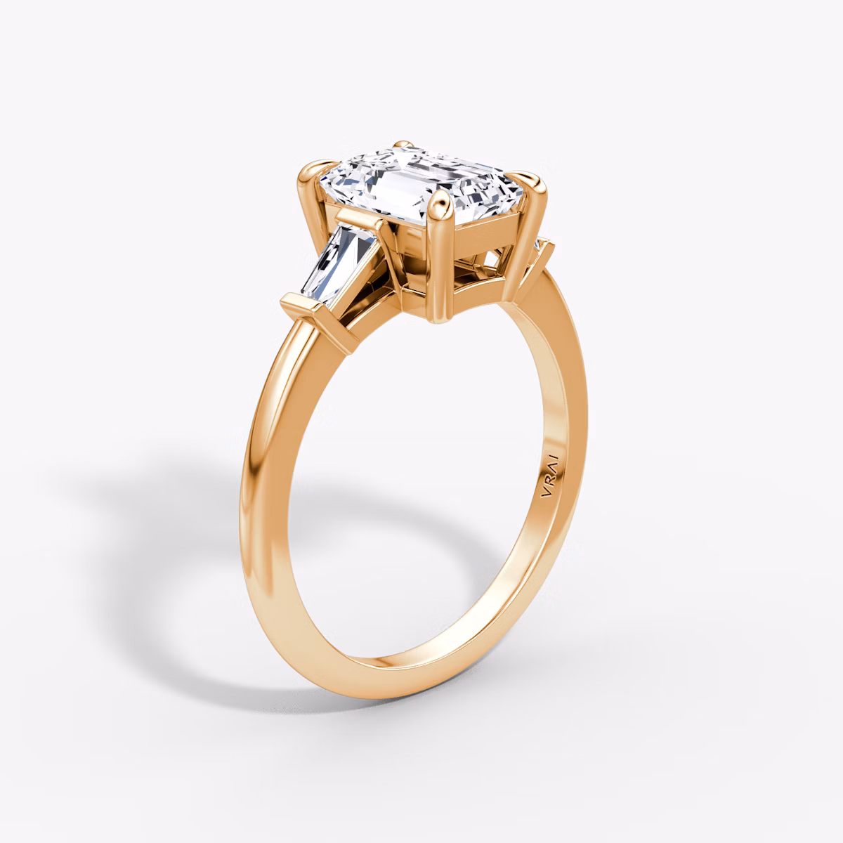 The Tapered Baguette Three Stone | Emerald | 14k | Rose Gold | bandAccent: Plain | caratWeight: 1.0ct | excludeFromFeed: null | diamondOrientation: vertical