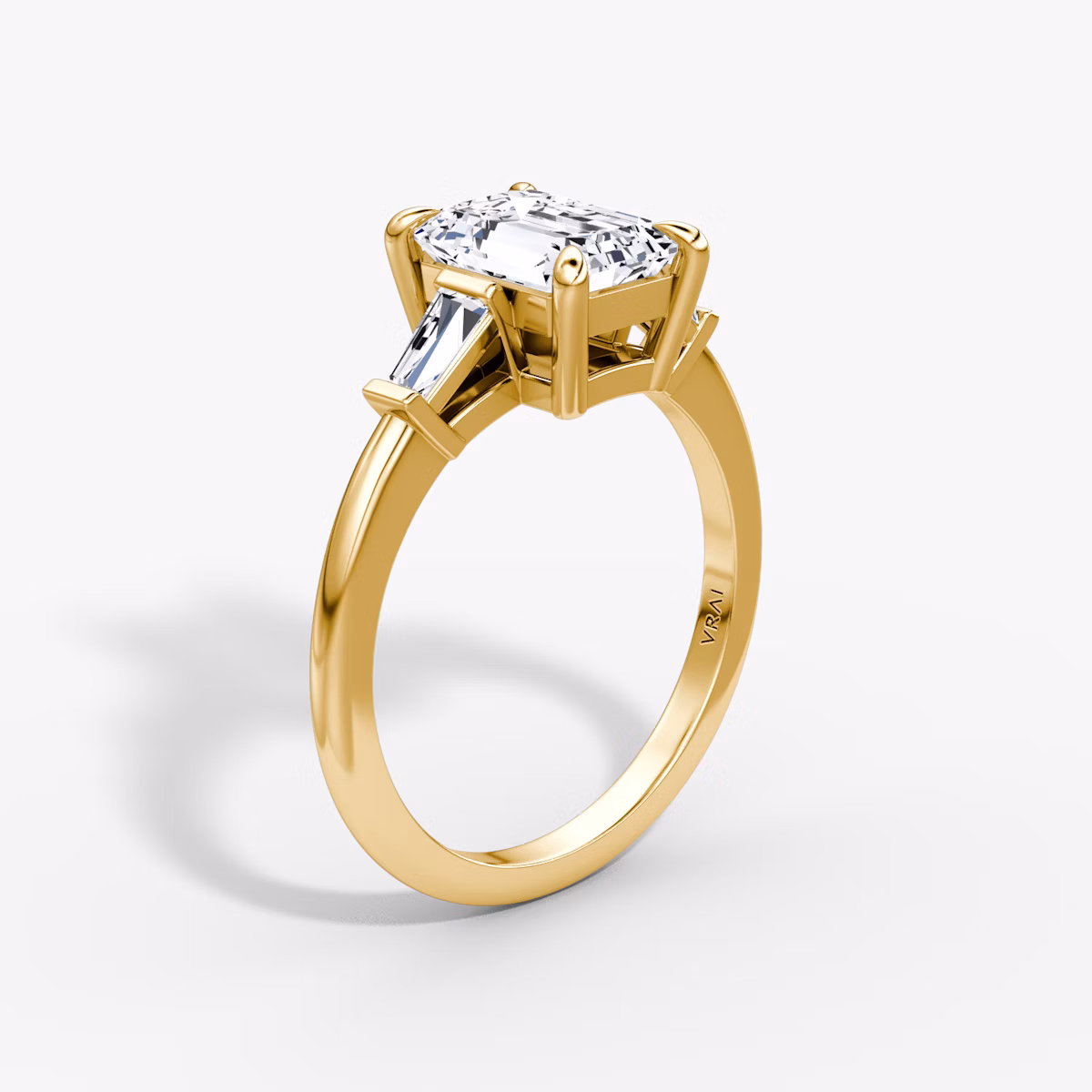 The Tapered Baguette Three Stone | Emerald | 18k | Yellow Gold | bandAccent: Plain | caratWeight: 1.0ct | excludeFromFeed: null | diamondOrientation: vertical
