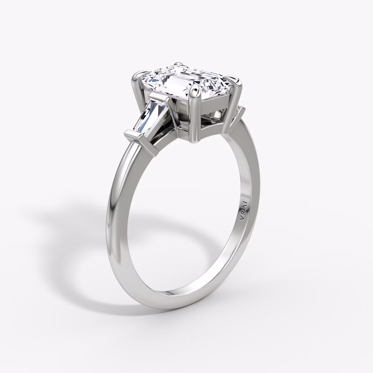 The Tapered Baguette Three Stone | Emerald | 18k | White Gold | bandAccent: Plain | caratWeight: 1.0ct | excludeFromFeed: null | diamondOrientation: vertical
