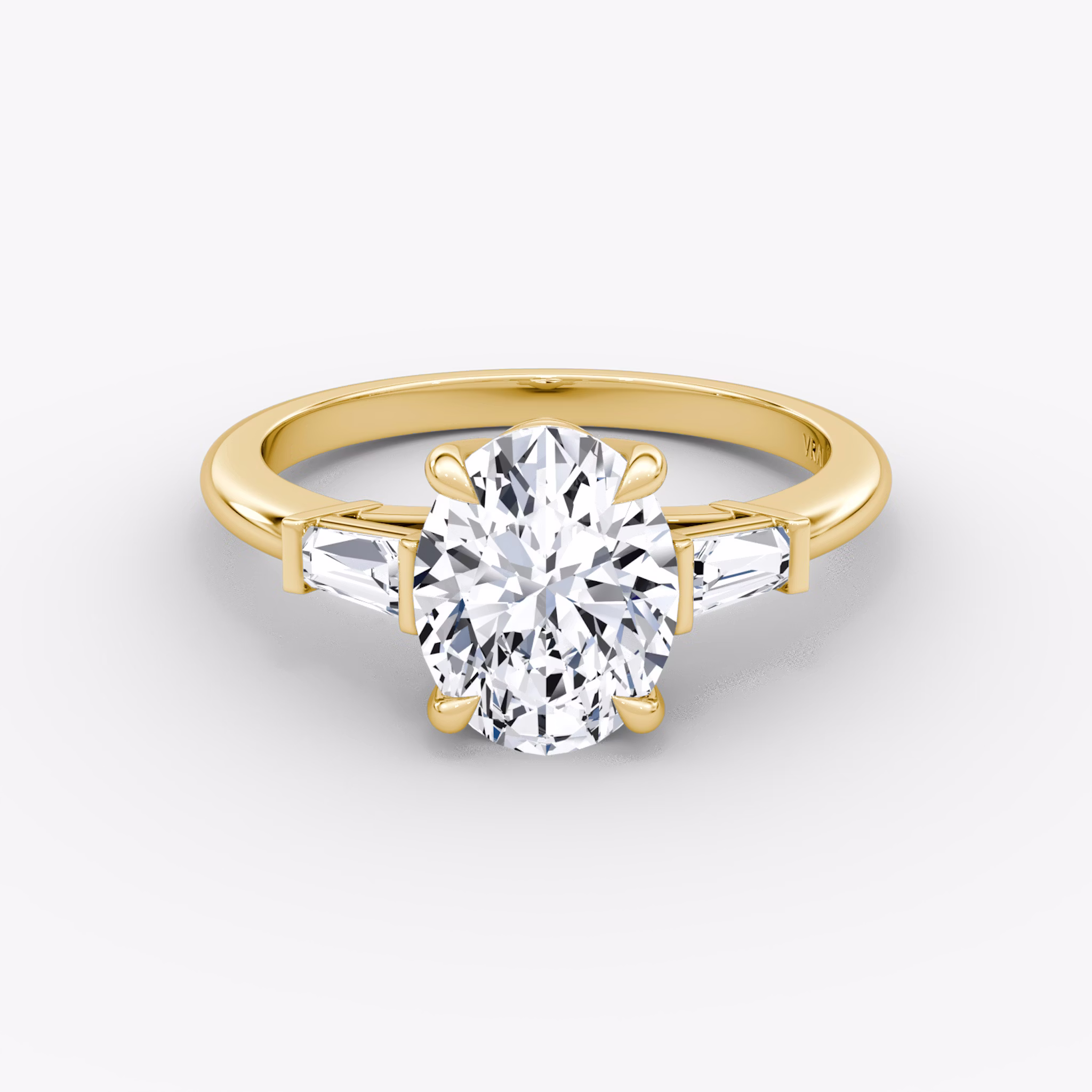 The Tapered Baguette Three Stone | Oval | 18k | Yellow Gold | bandAccent: Plain | excludeFromFeed: null | diamondOrientation: vertical | caratWeight: other