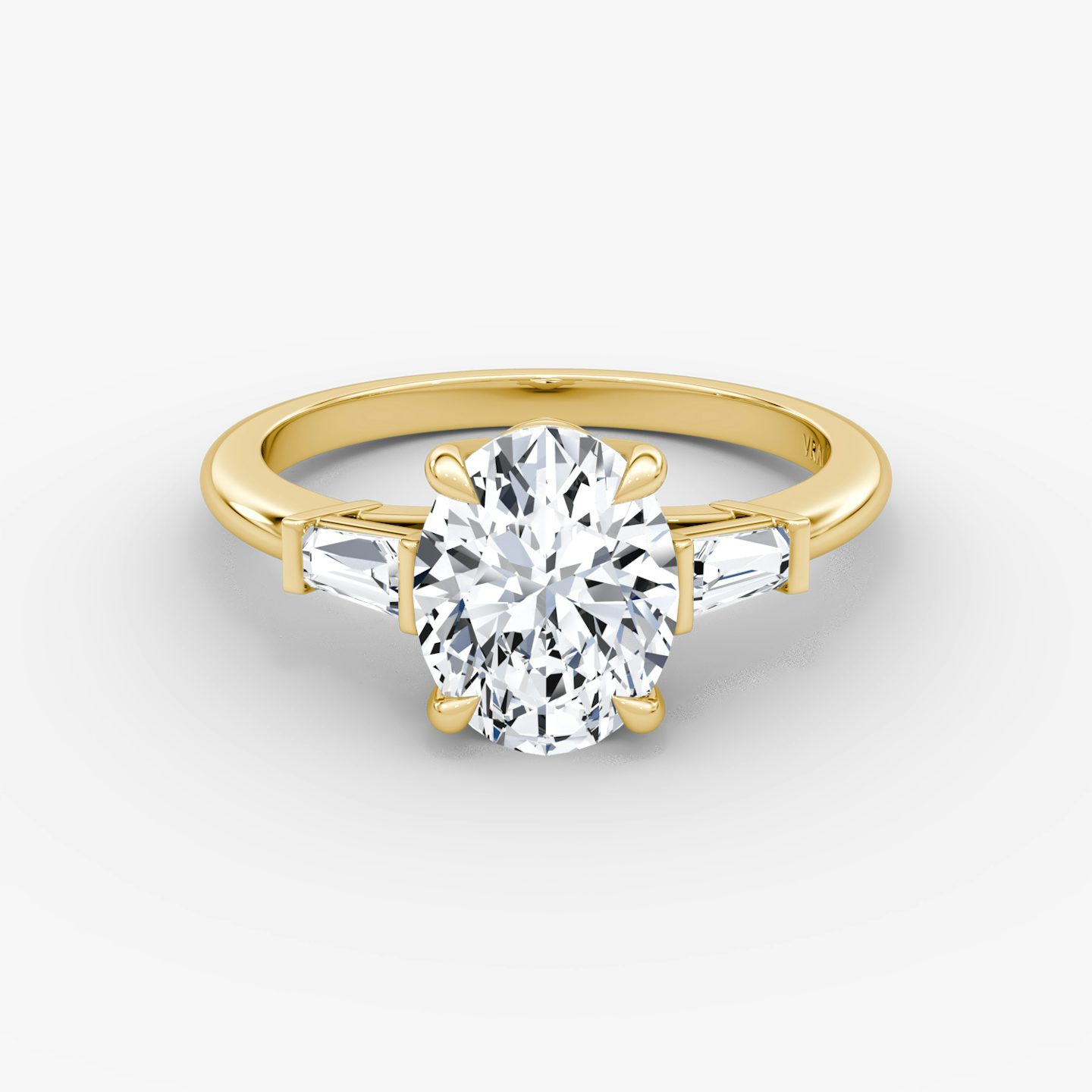 The Tapered Baguette Three Stone | Oval | 18k | Yellow Gold | bandAccent: Plain | excludeFromFeed: null | diamondOrientation: vertical | caratWeight: other
