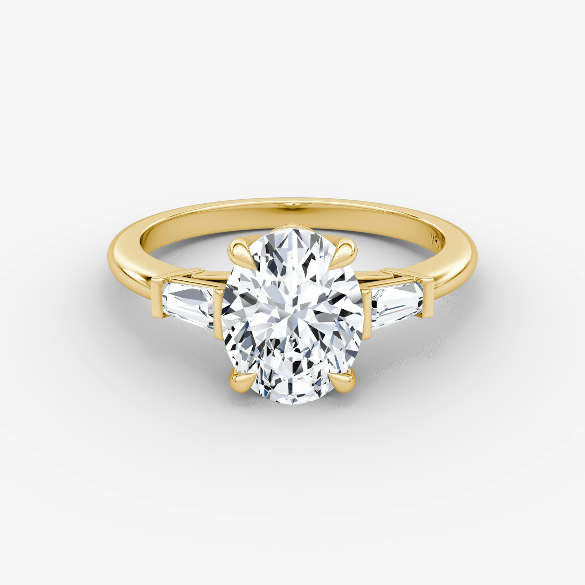 The Tapered Baguette Three Stone | Oval | 18k | Yellow Gold | bandAccent: Plain | excludeFromFeed: null | diamondOrientation: vertical | caratWeight: other