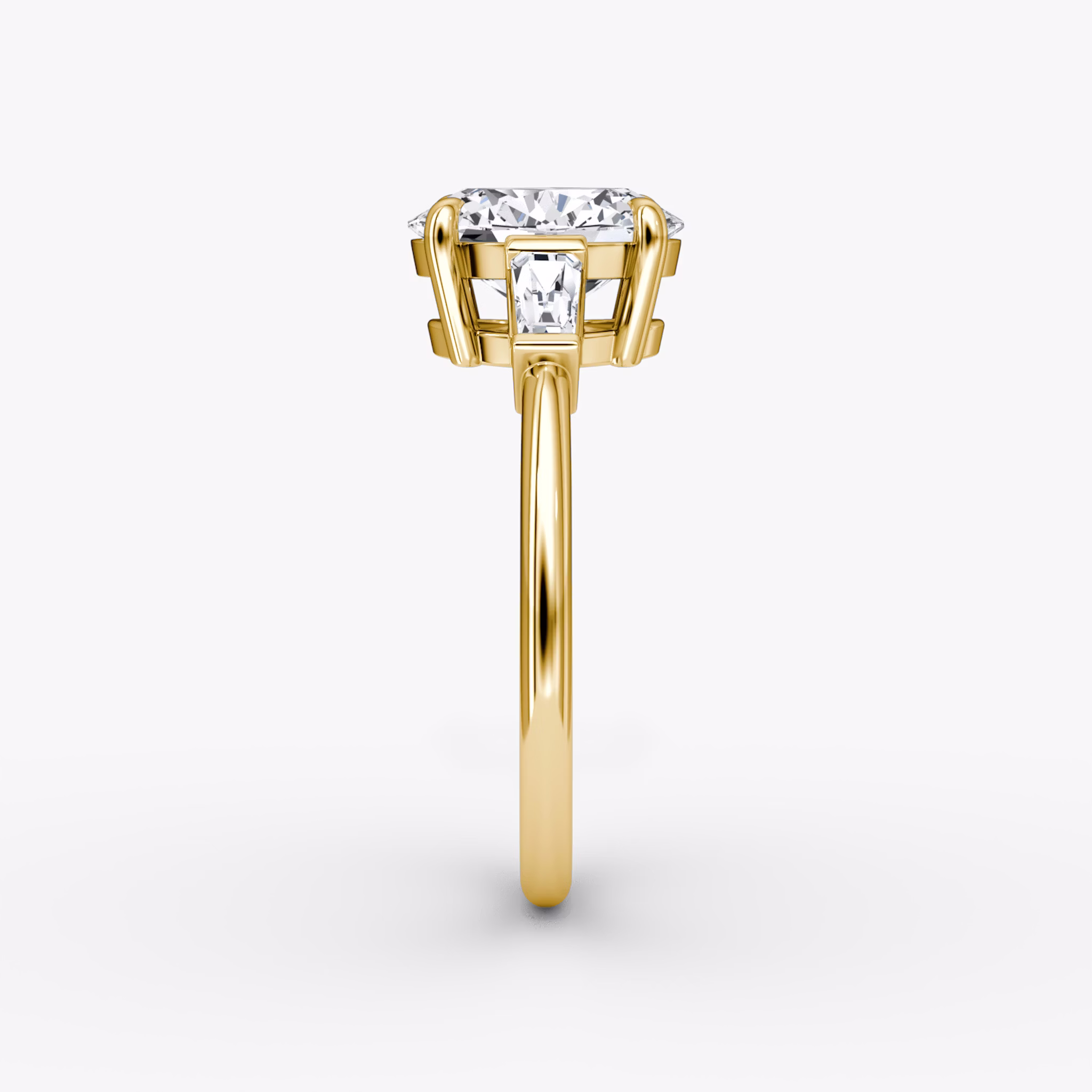 The Tapered Baguette Three Stone | Oval | 18k | Yellow Gold | bandAccent: Plain | excludeFromFeed: null | diamondOrientation: vertical | caratWeight: other