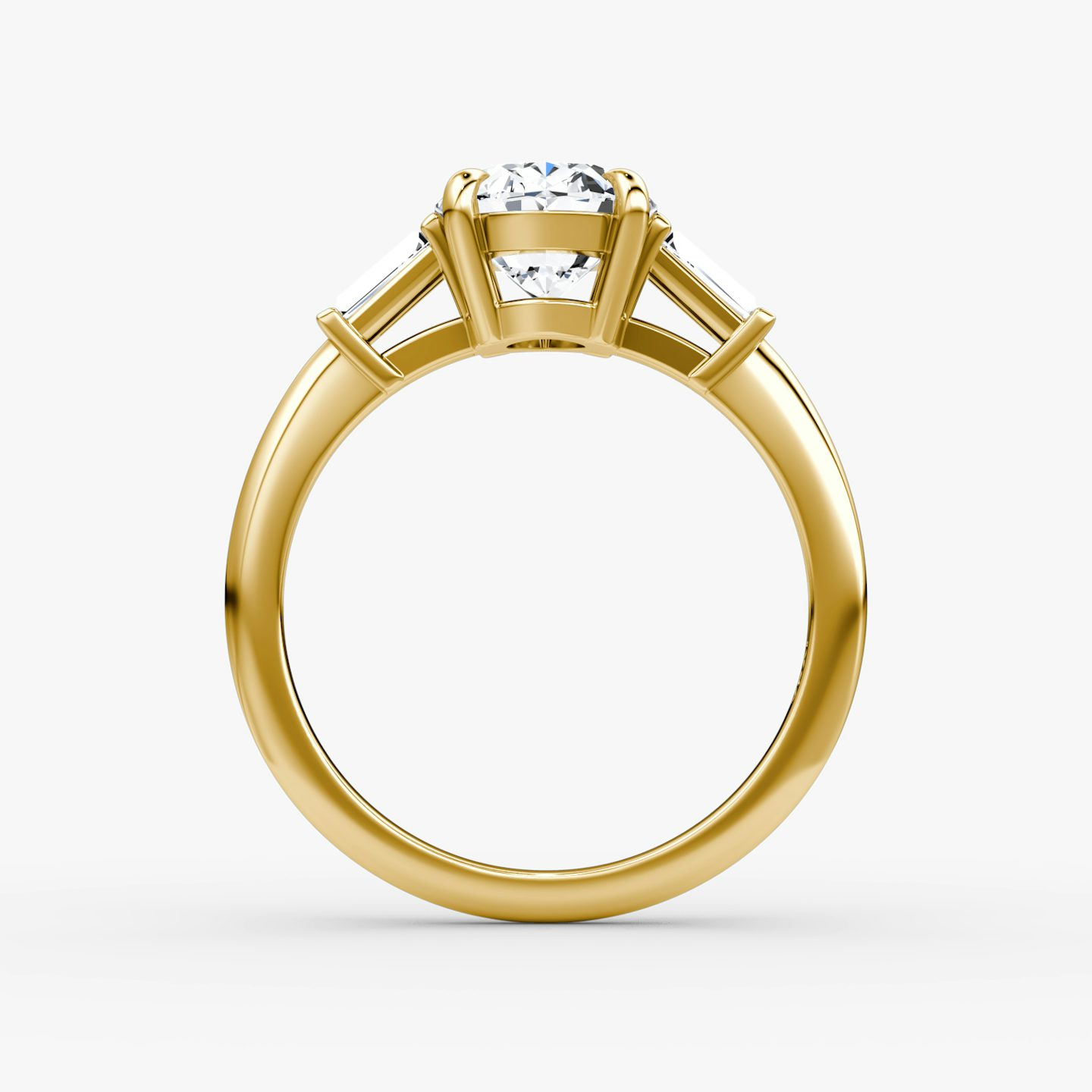 The Tapered Baguette Three Stone | Oval | 18k | Yellow Gold | bandAccent: Plain | excludeFromFeed: null | diamondOrientation: vertical | caratWeight: other