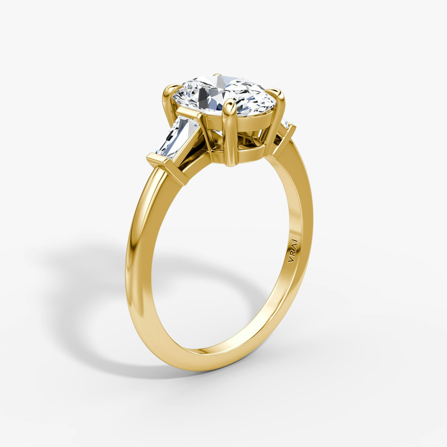 The Tapered Baguette Three Stone | Oval | 18k | Yellow Gold | bandAccent: Plain | excludeFromFeed: null | diamondOrientation: vertical | caratWeight: other