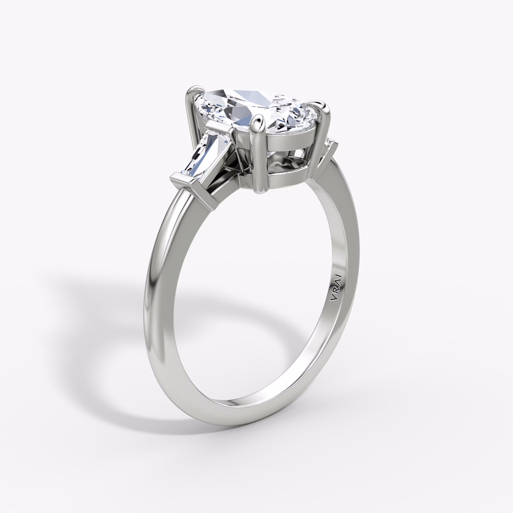 The Tapered Baguette Three Stone | Pear | 18k | White Gold | bandAccent: Plain | excludeFromFeed: null | diamondOrientation: vertical | caratWeight: other