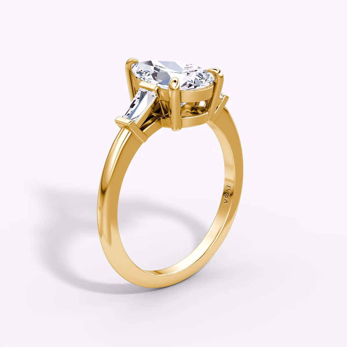 The Tapered Baguette Three Stone | Pear | 18k | Yellow Gold | bandAccent: Plain | caratWeight: 1.0ct | excludeFromFeed: null | diamondOrientation: vertical