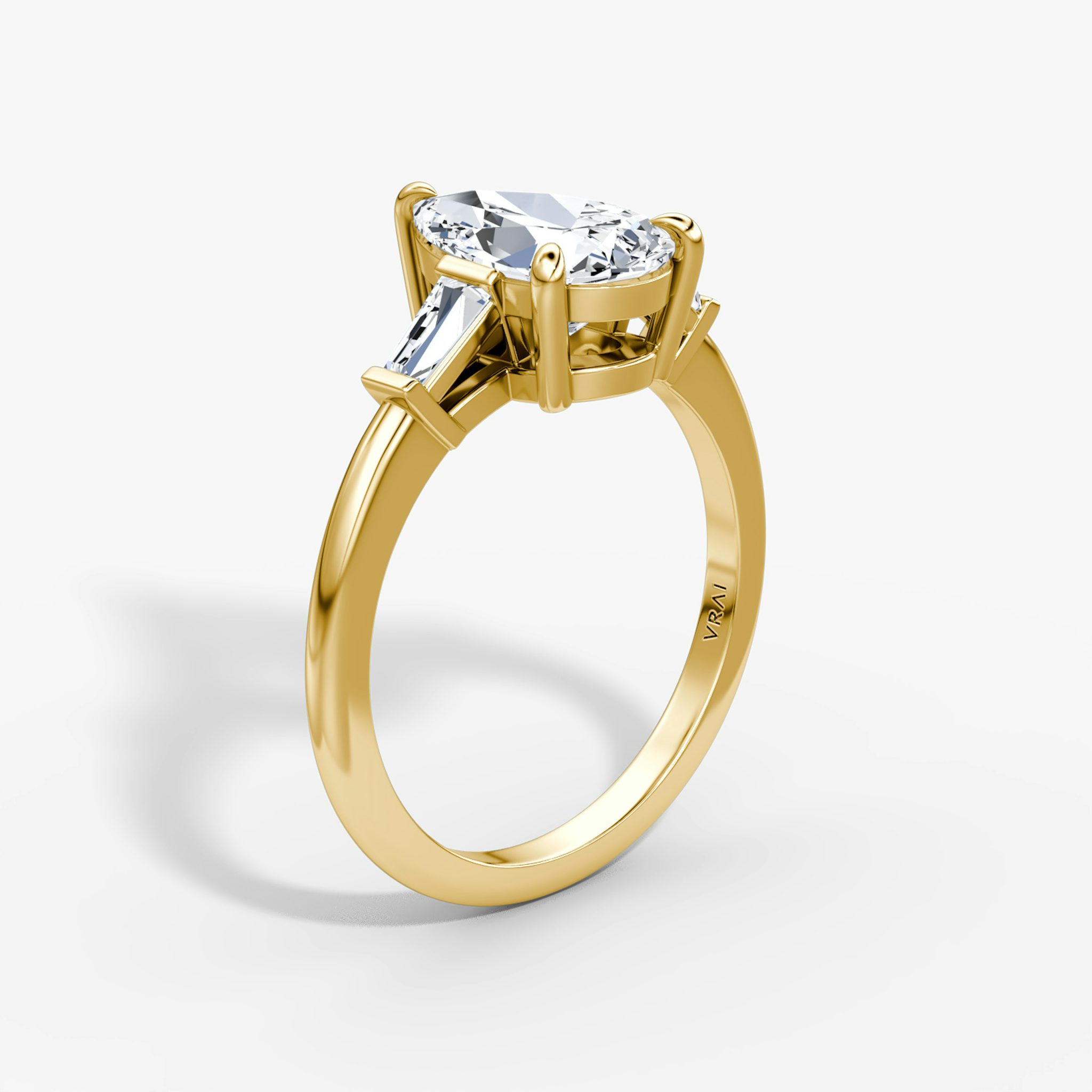 The Tapered Baguette Three Stone | Pear | 18k | Yellow Gold | bandAccent: Plain | excludeFromFeed: null | diamondOrientation: vertical | caratWeight: other