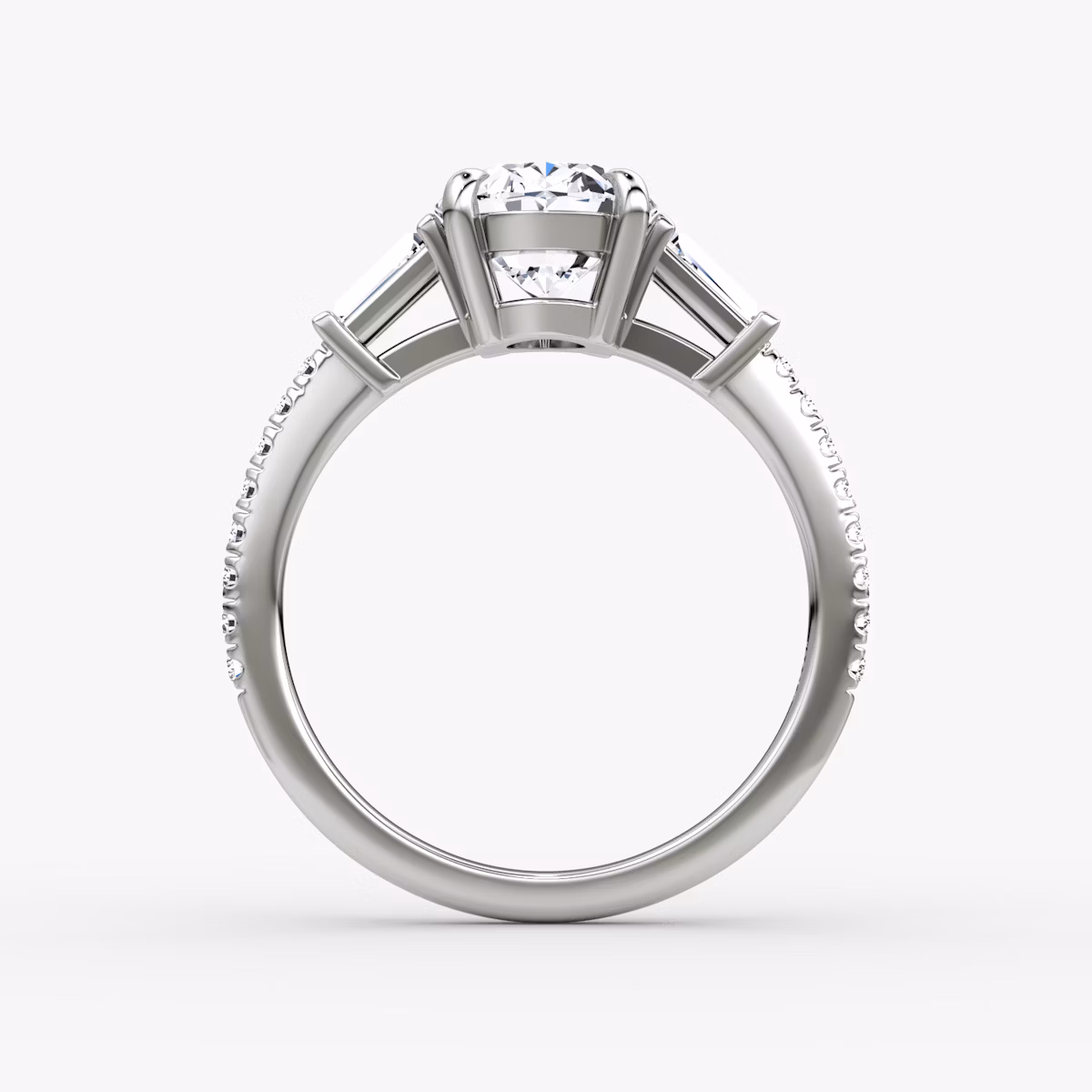 The Tapered Baguette Three Stone | Oval | Platinum | bandAccent: Pavé | caratWeight: 1.0ct | excludeFromFeed: null | diamondOrientation: vertical