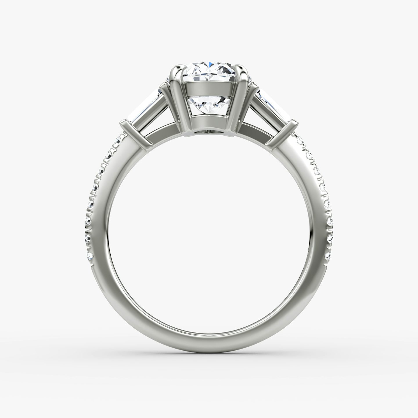 The Tapered Baguette Three Stone | Oval | 18k | White Gold | bandAccent: Pavé | excludeFromFeed: null | diamondOrientation: vertical | caratWeight: other