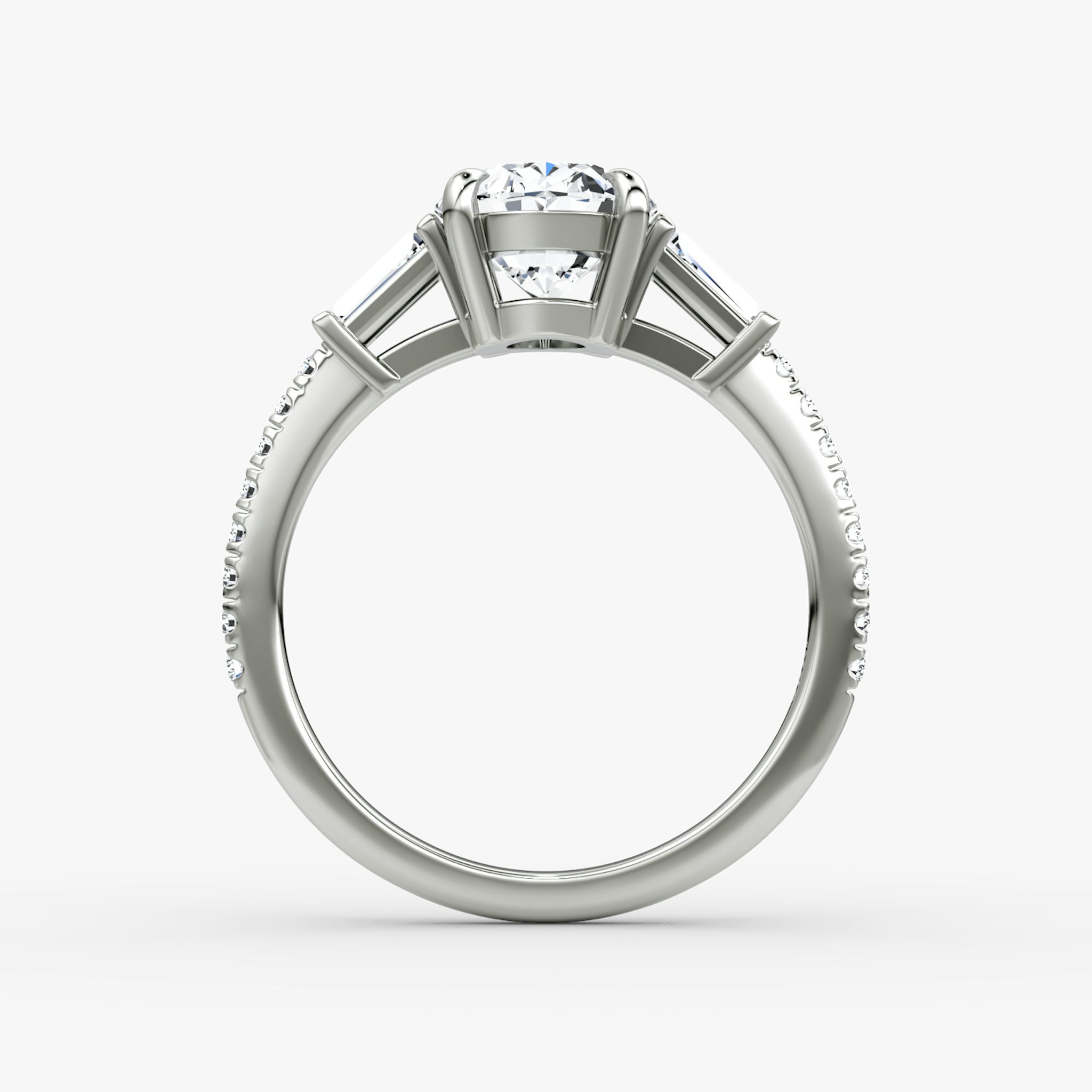 The Tapered Baguette Three Stone | Oval | 18k | White Gold | bandAccent: Pavé | excludeFromFeed: null | diamondOrientation: vertical | caratWeight: other