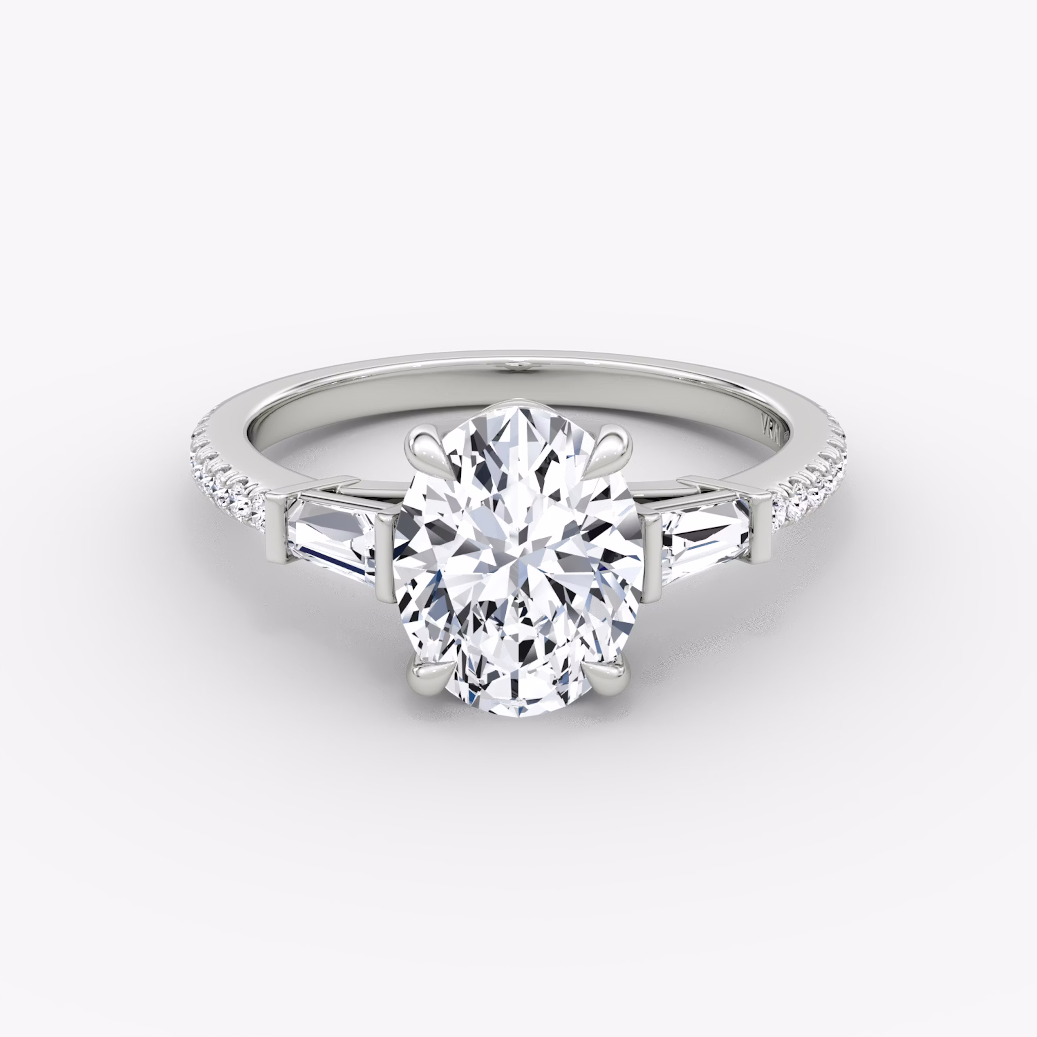 The Tapered Baguette Three Stone | Oval | 18k | White Gold | bandAccent: Pavé | excludeFromFeed: null | diamondOrientation: vertical | caratWeight: other