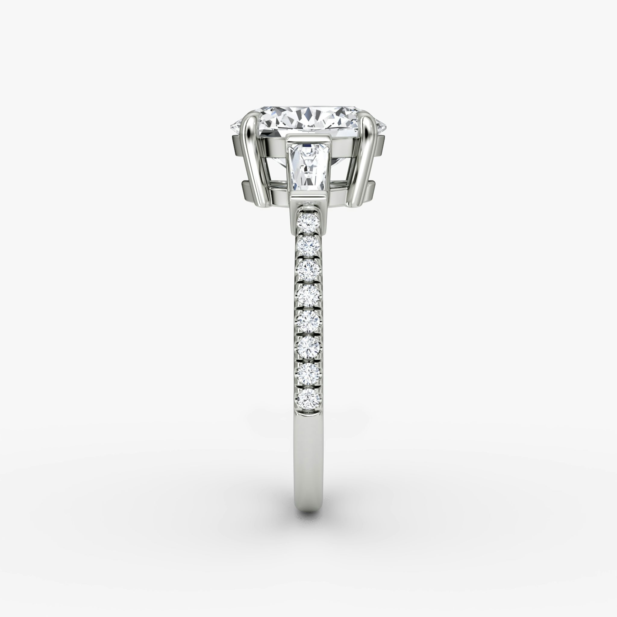The Tapered Baguette Three Stone | Oval | 18k | White Gold | bandAccent: Pavé | excludeFromFeed: null | diamondOrientation: vertical | caratWeight: other